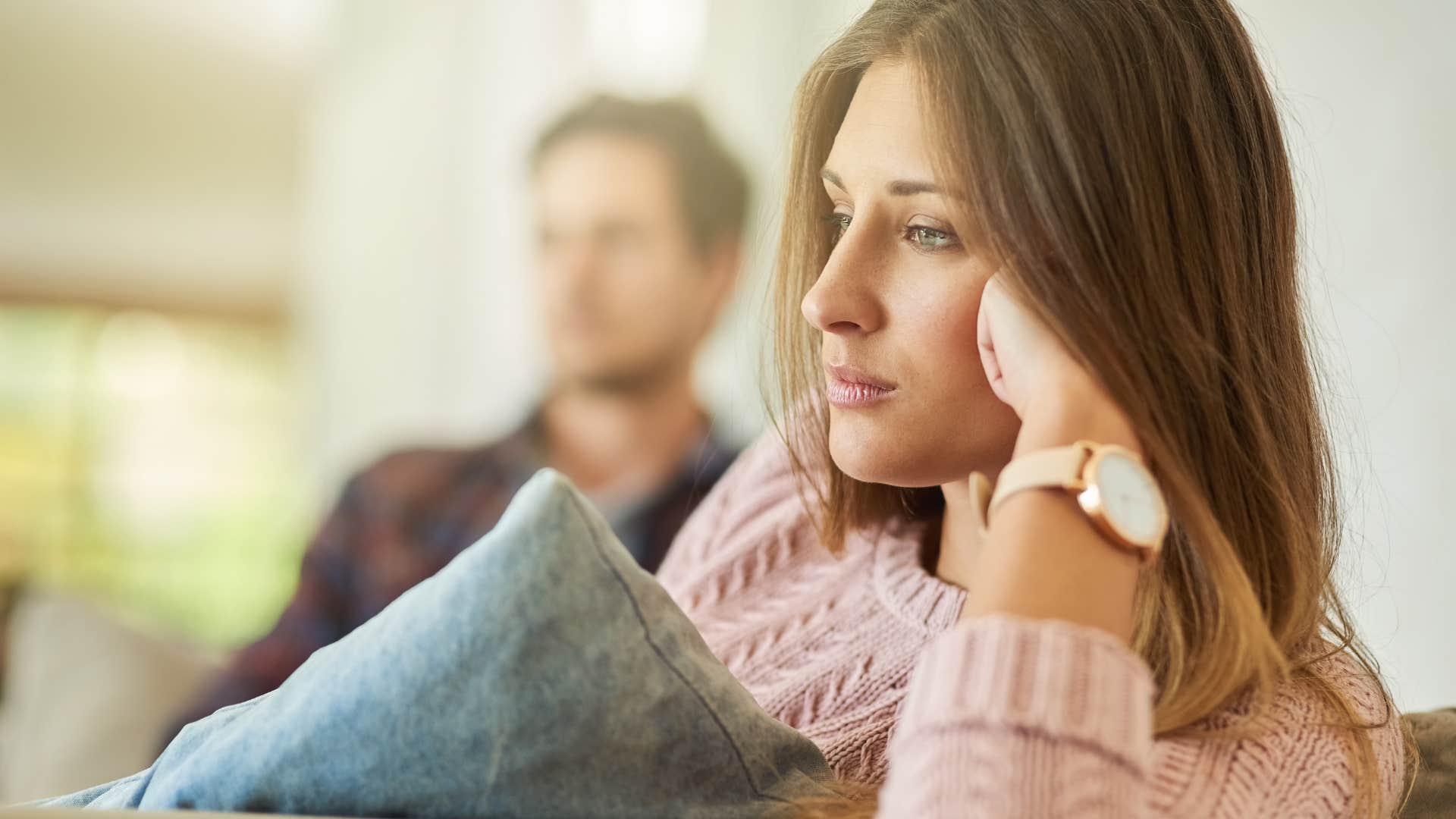 woman showing no emotional intimacy looking away from husband