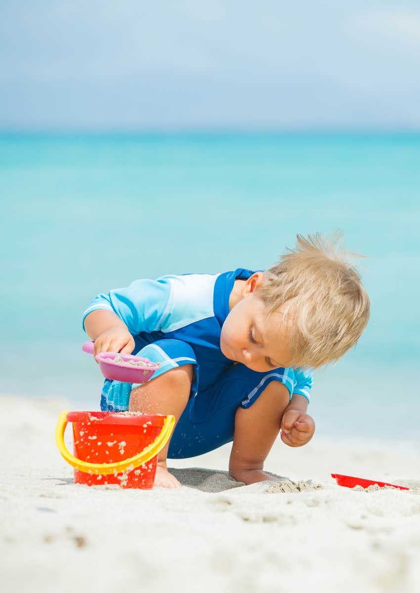 child playing unattended at beach
