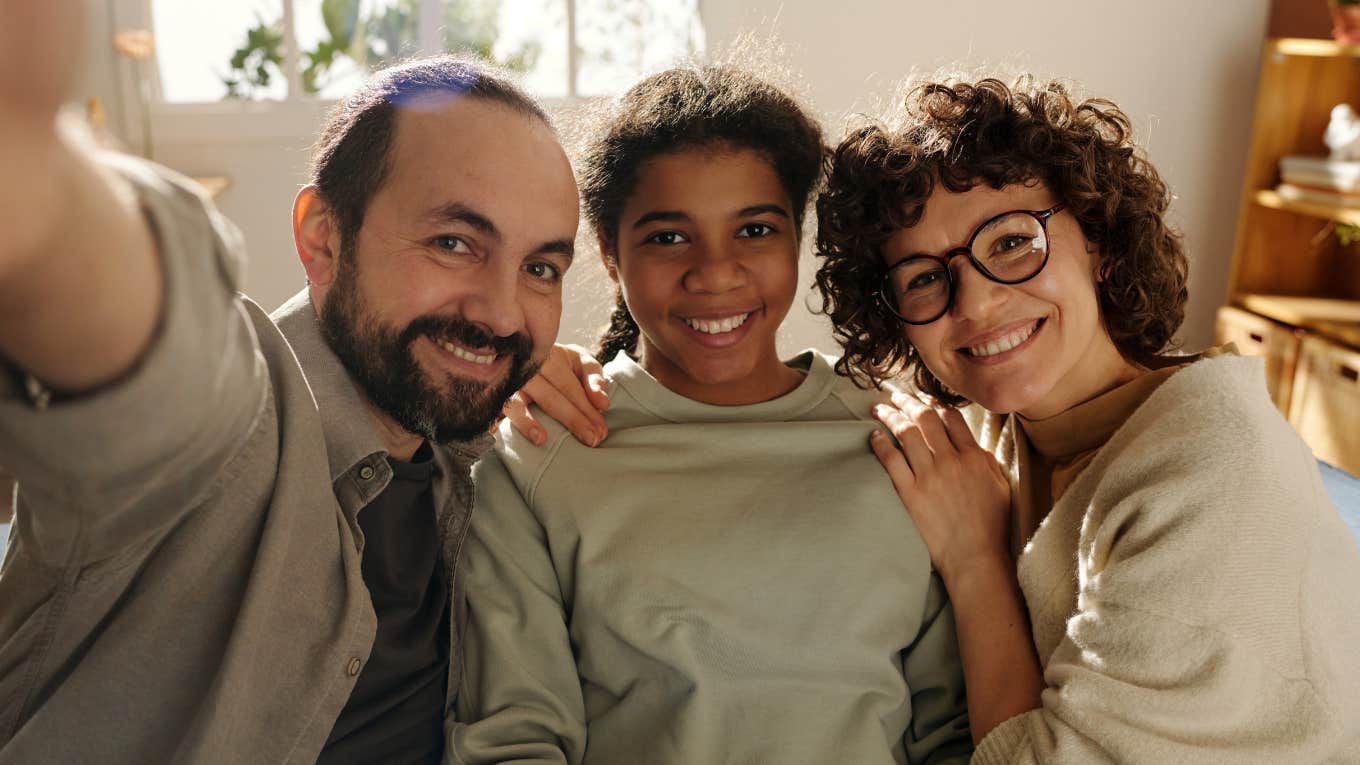 Life Cheat Codes Brilliant Parents Pass On To Their Kids Before It's Too Late parents with teen daughter smiling teaching her life cheat codes
