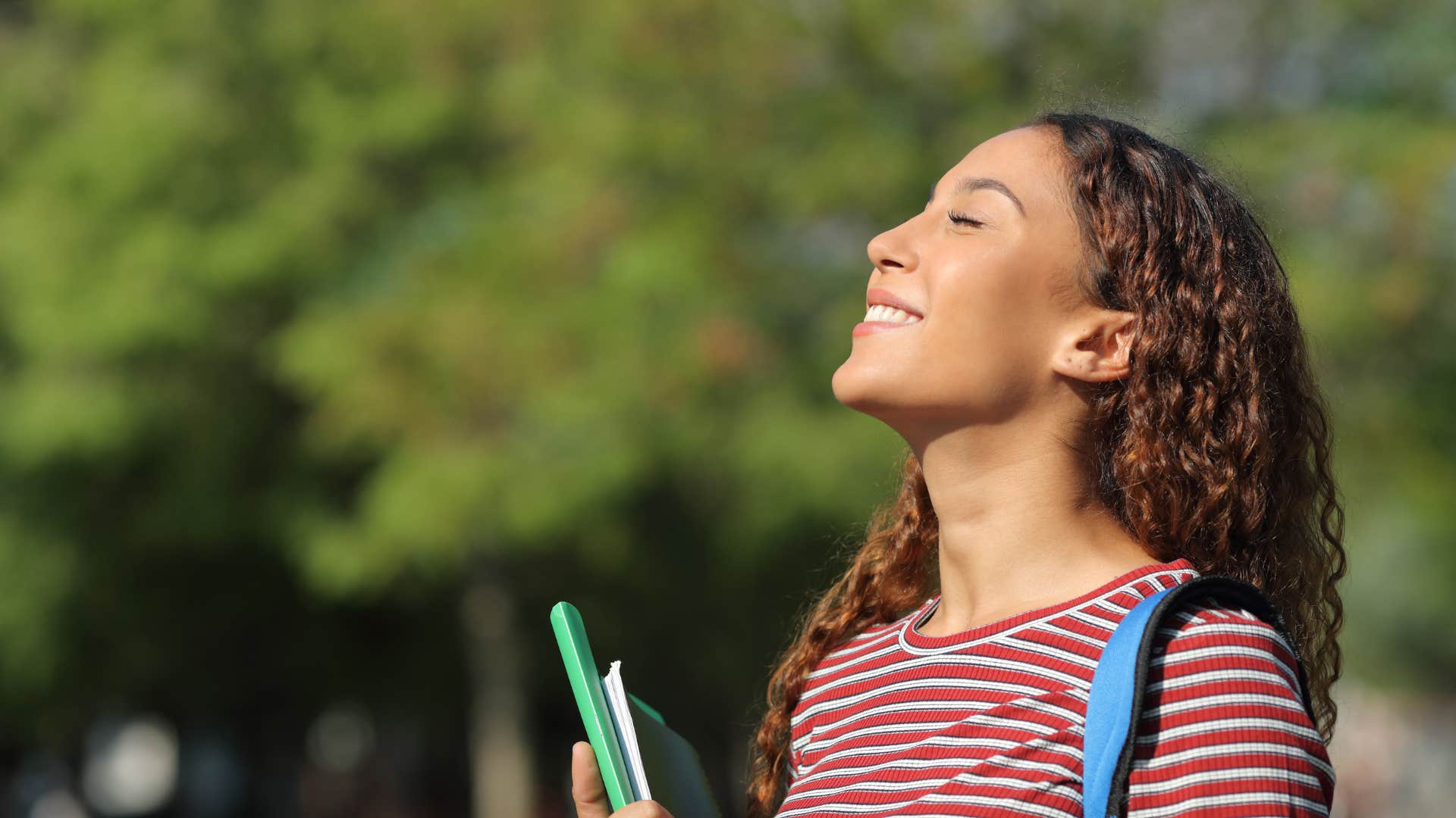 teenage girl smiling keeping her body strong and kind