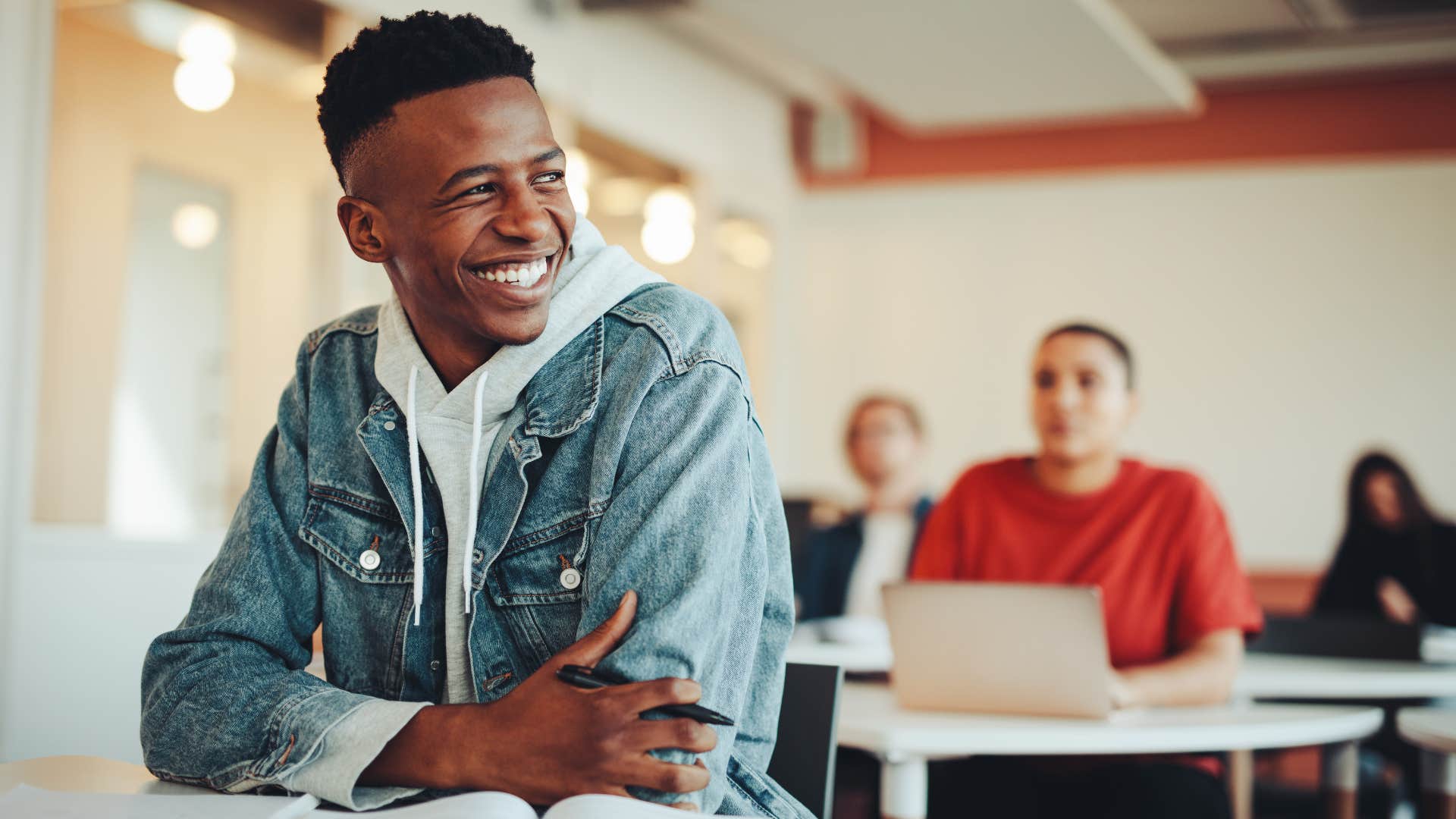 smiling young man being grateful present and brave