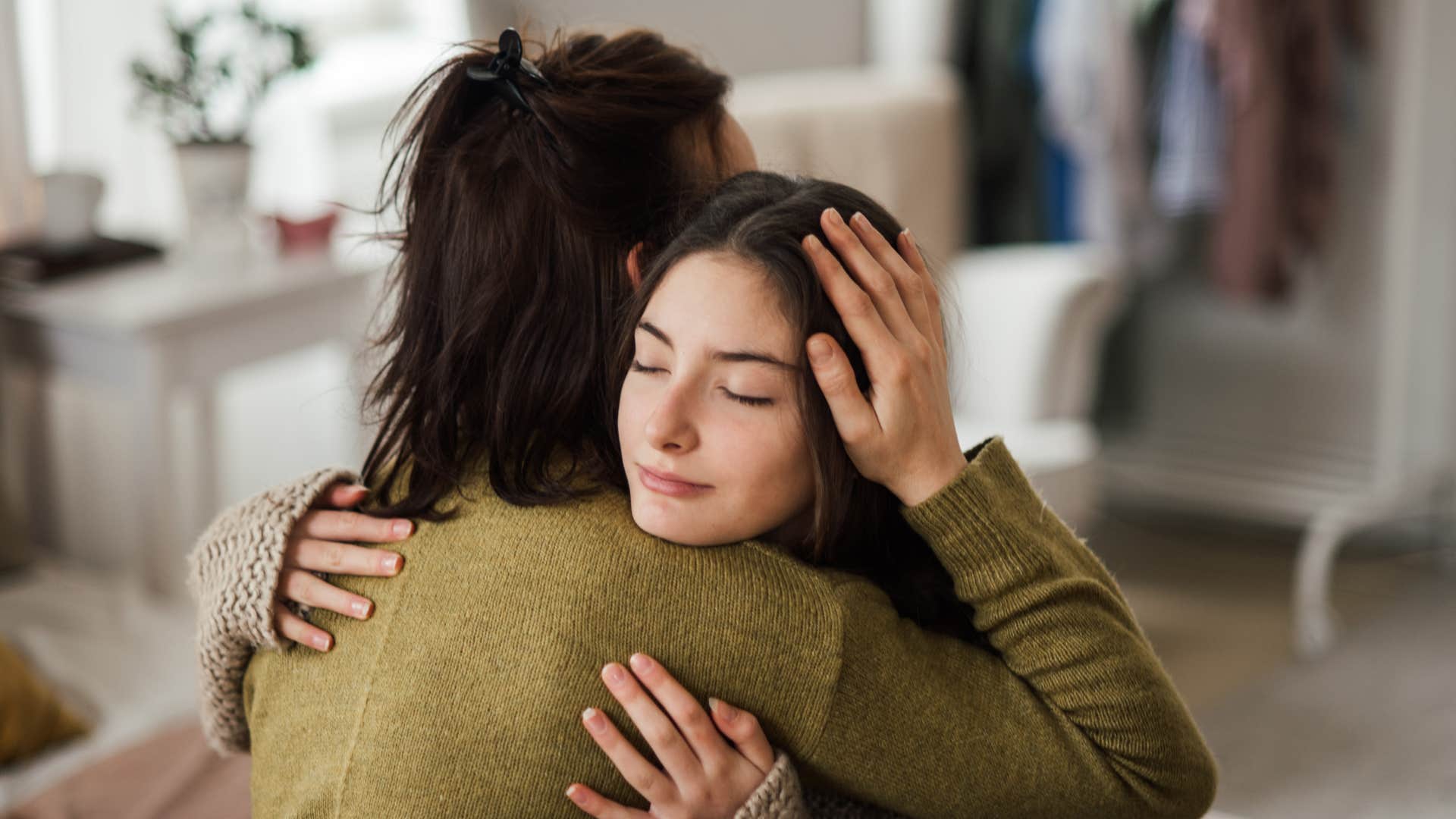 mom hugging daughter teaching her to protect love respect and trust
