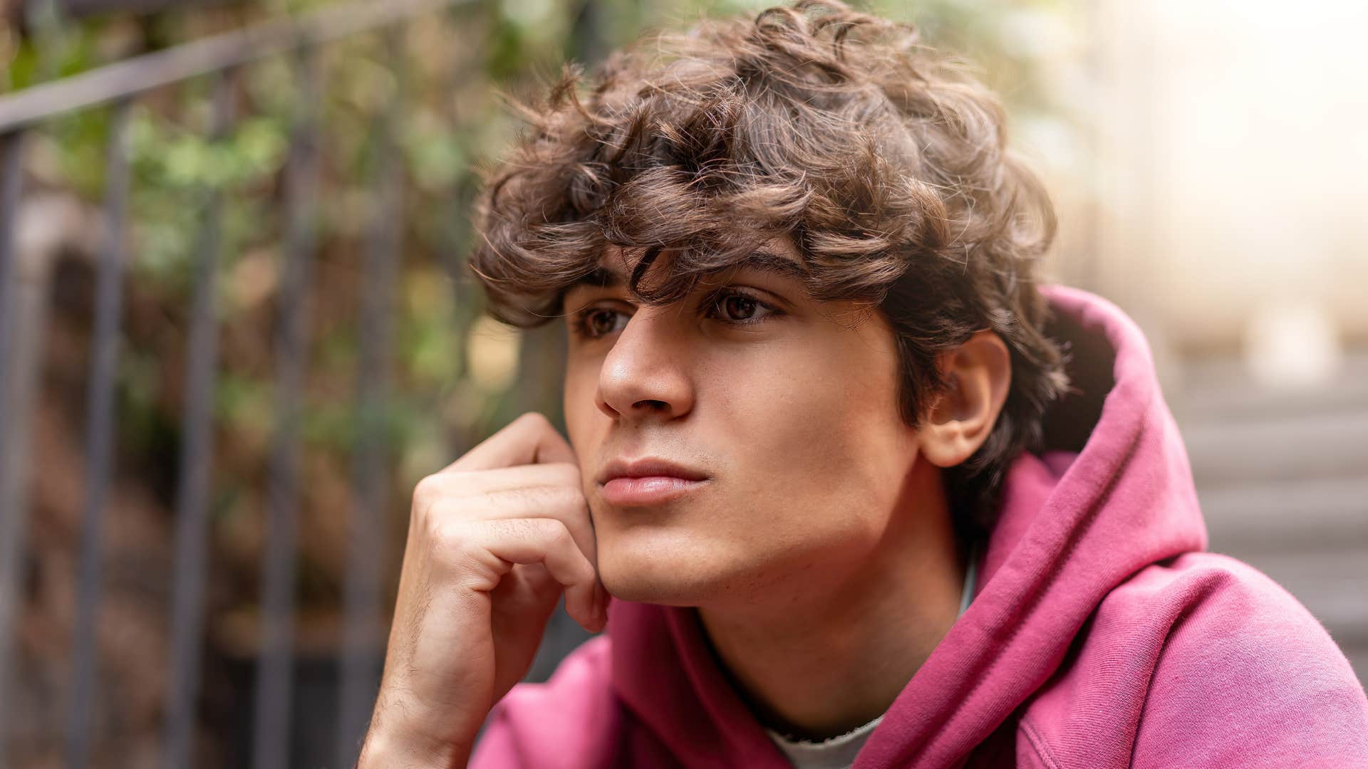teenage boy in deep reflection as he understands that he's not his thoughts