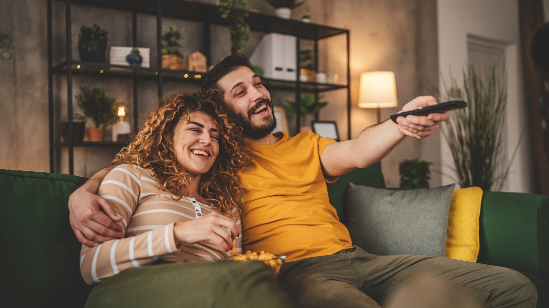 couple re-watching tv to look for missing details