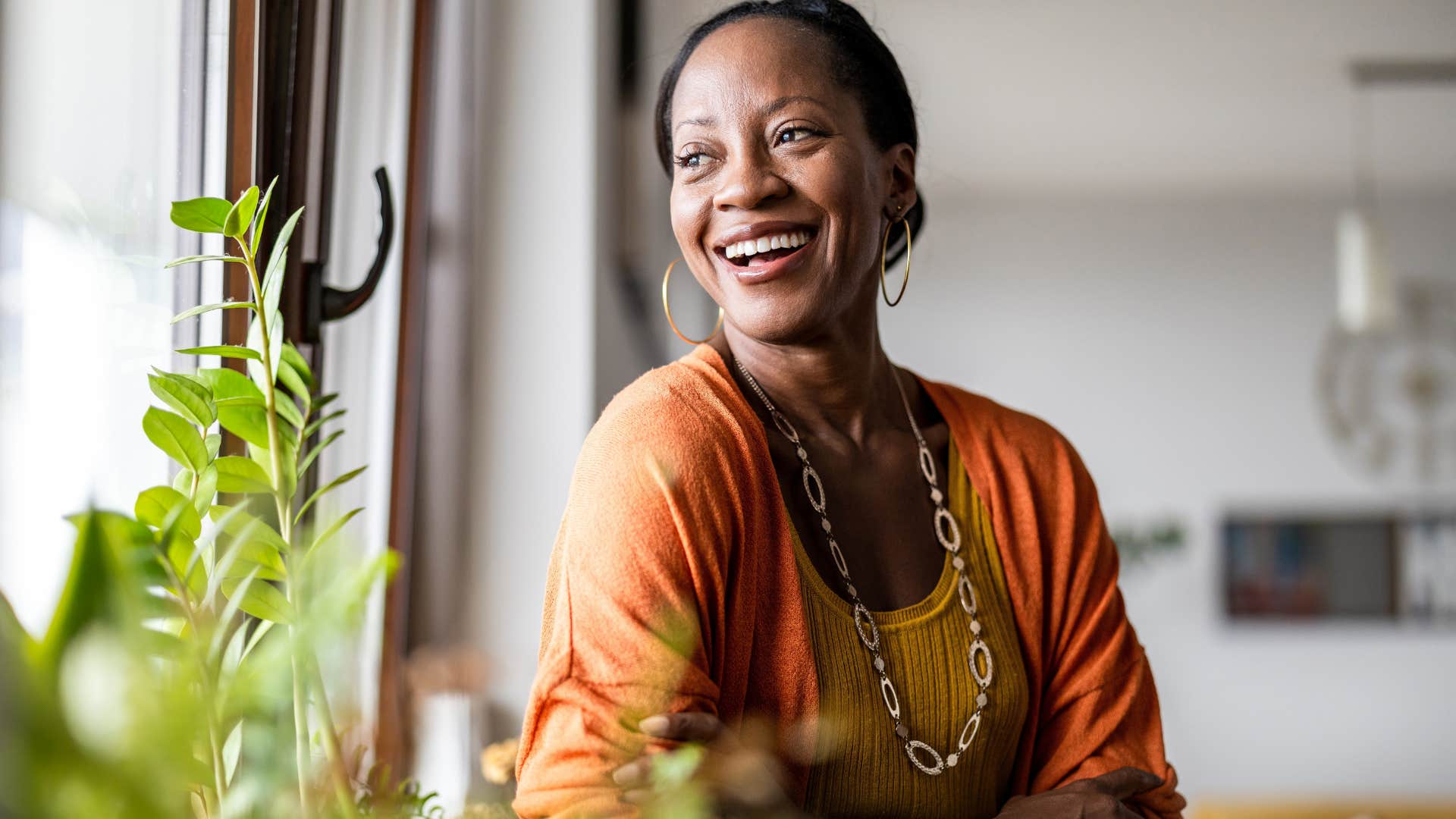 classy woman smiling about little notes and gifts in her home