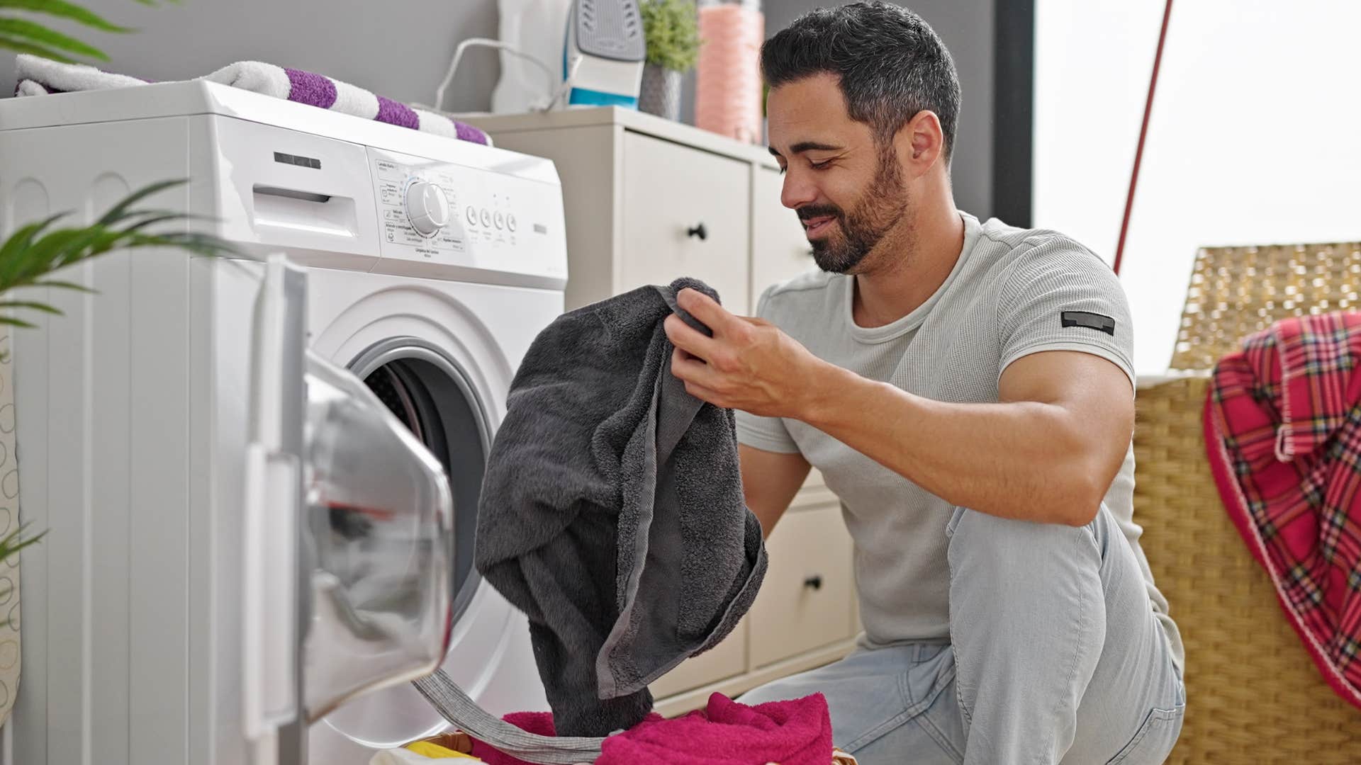 man using unnecessary laundry products in dryer