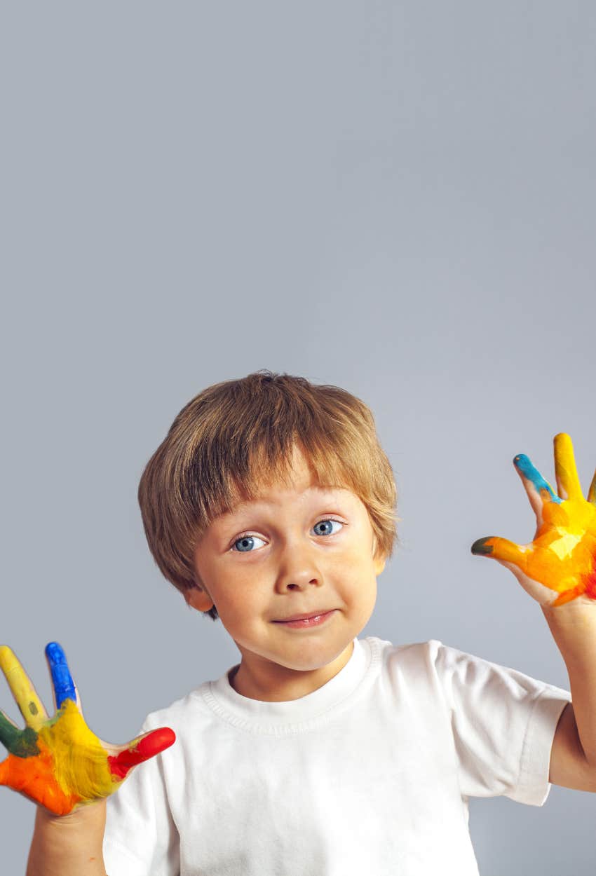 little boy covered in paint with a favorite color