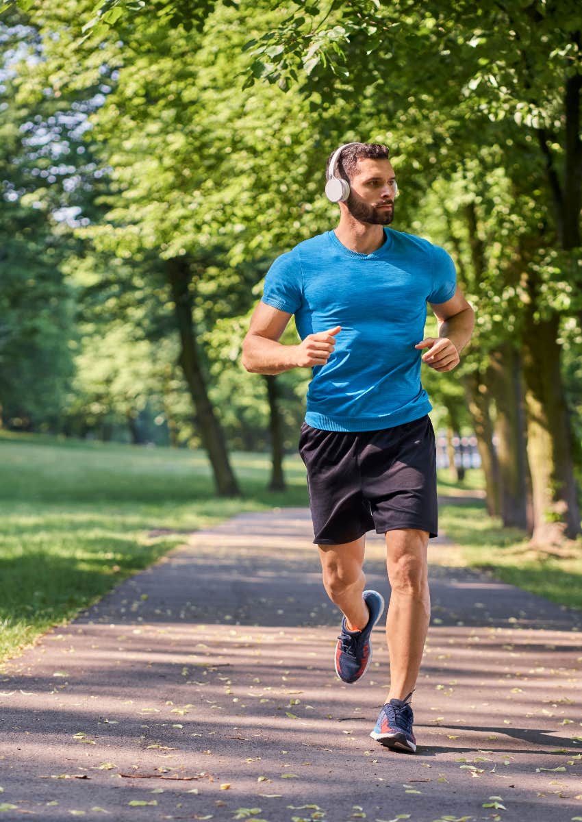 man running in park to improve heart health