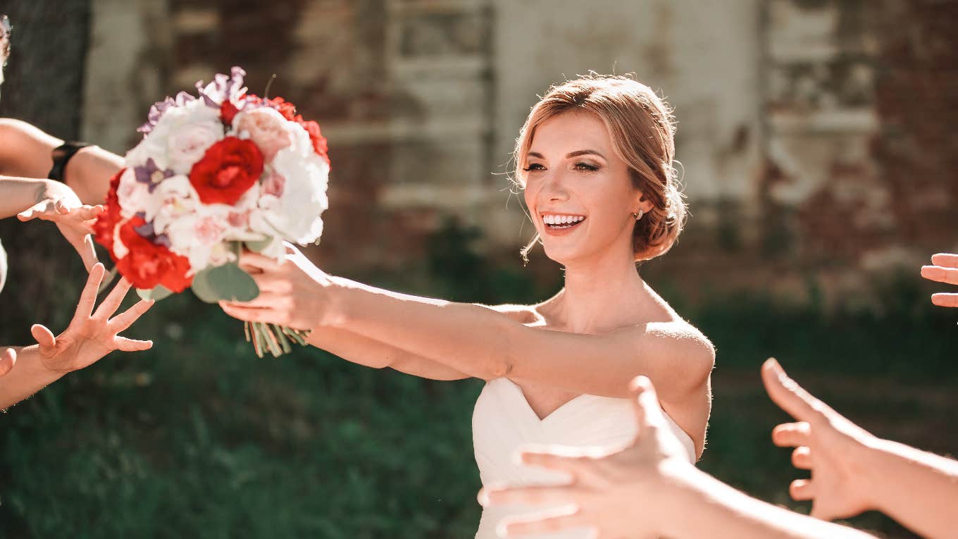 bride preparing to toss the bouquet