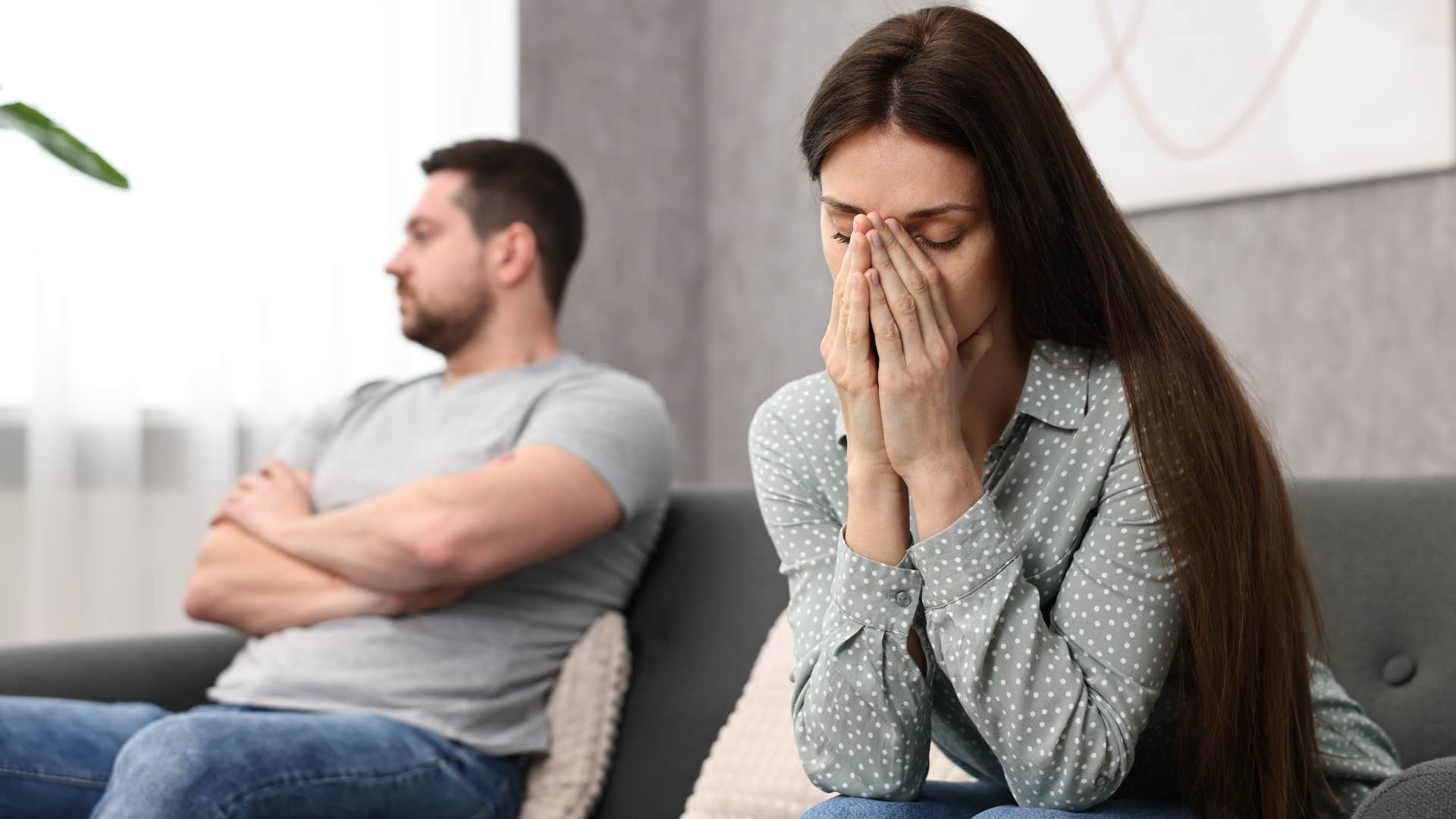 couple avoiding conflict at all costs turned away from each other
