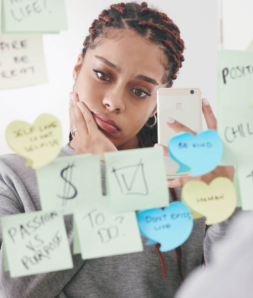 Mindful woman looks at sticky notes