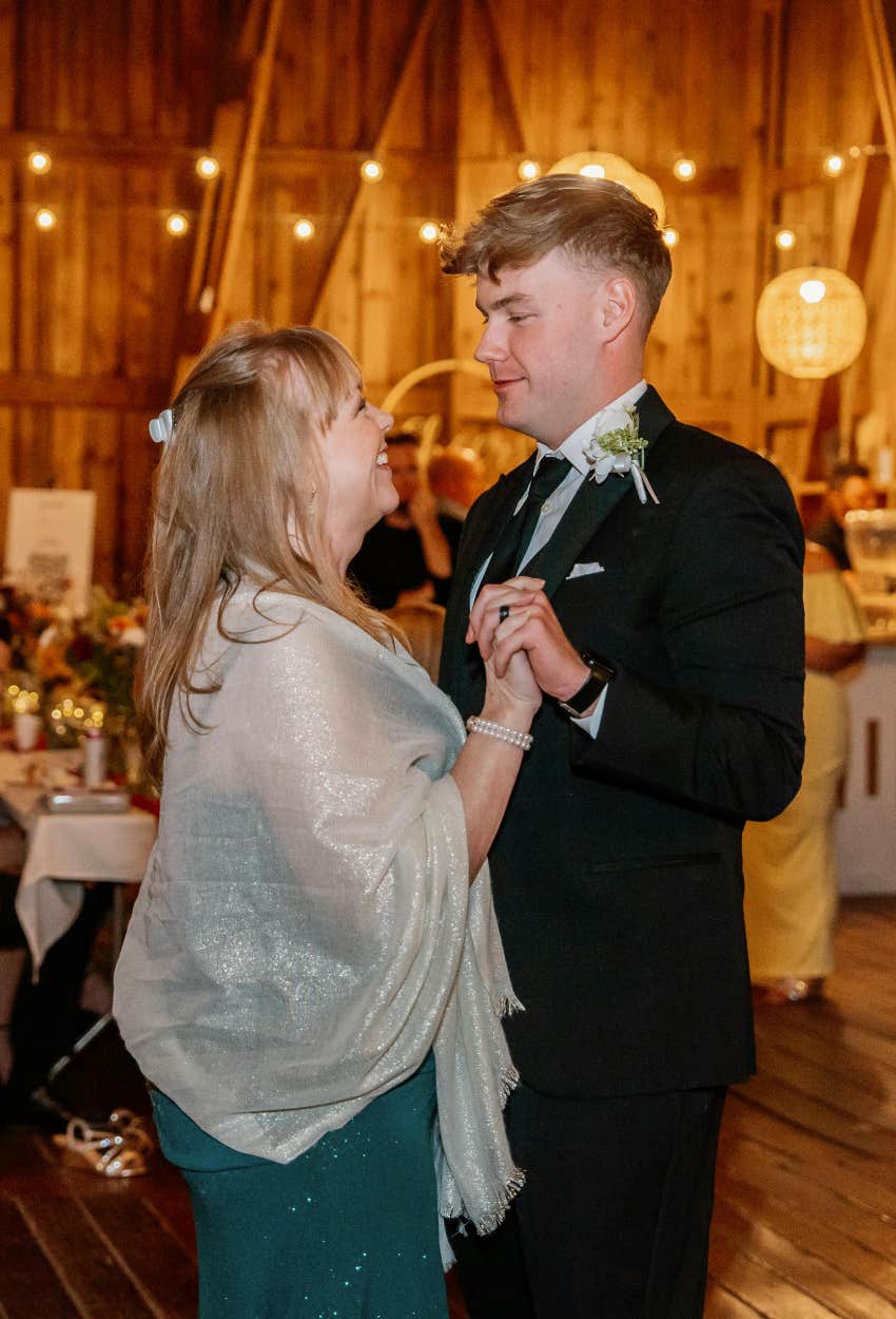 mother of the groom dancing with her son