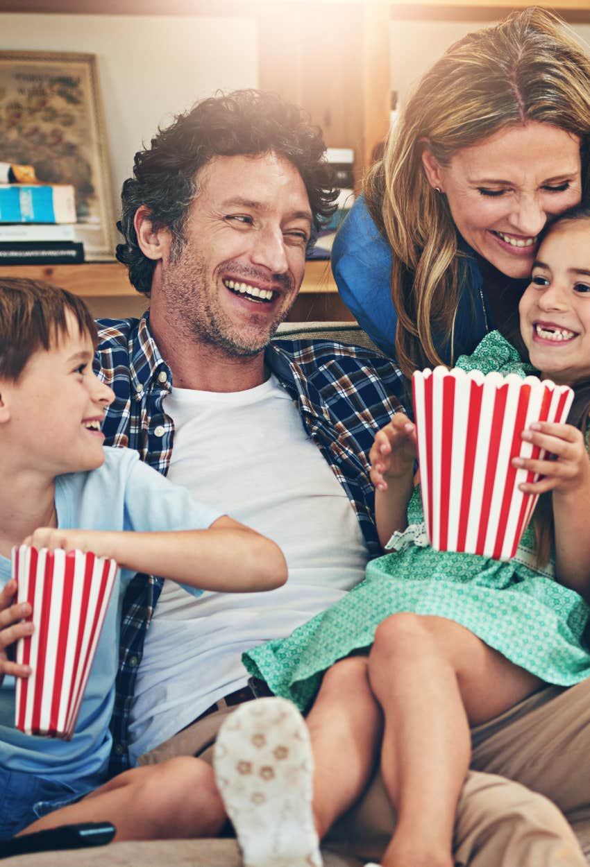 family eating popcorn during family movie night mom happy failed
