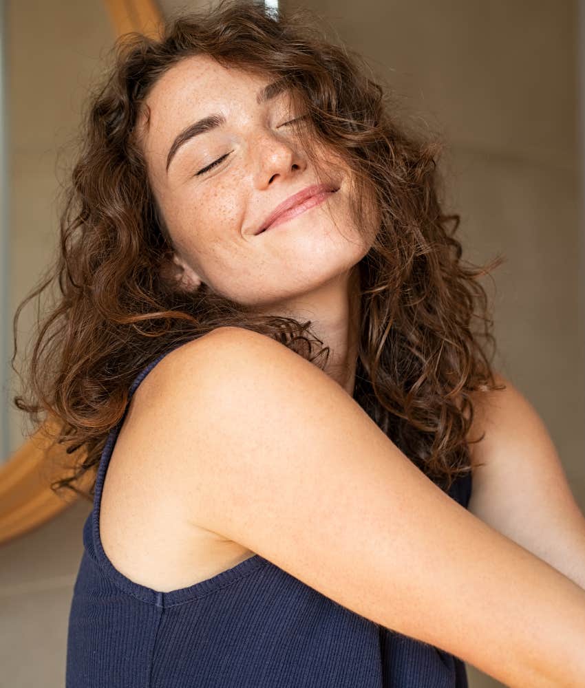 Radiant woman wakes up joyful