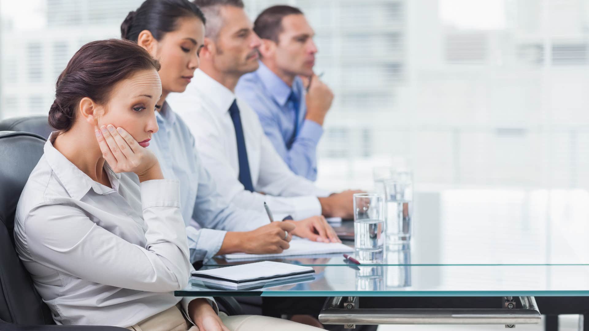 introverted woman in an office meeting