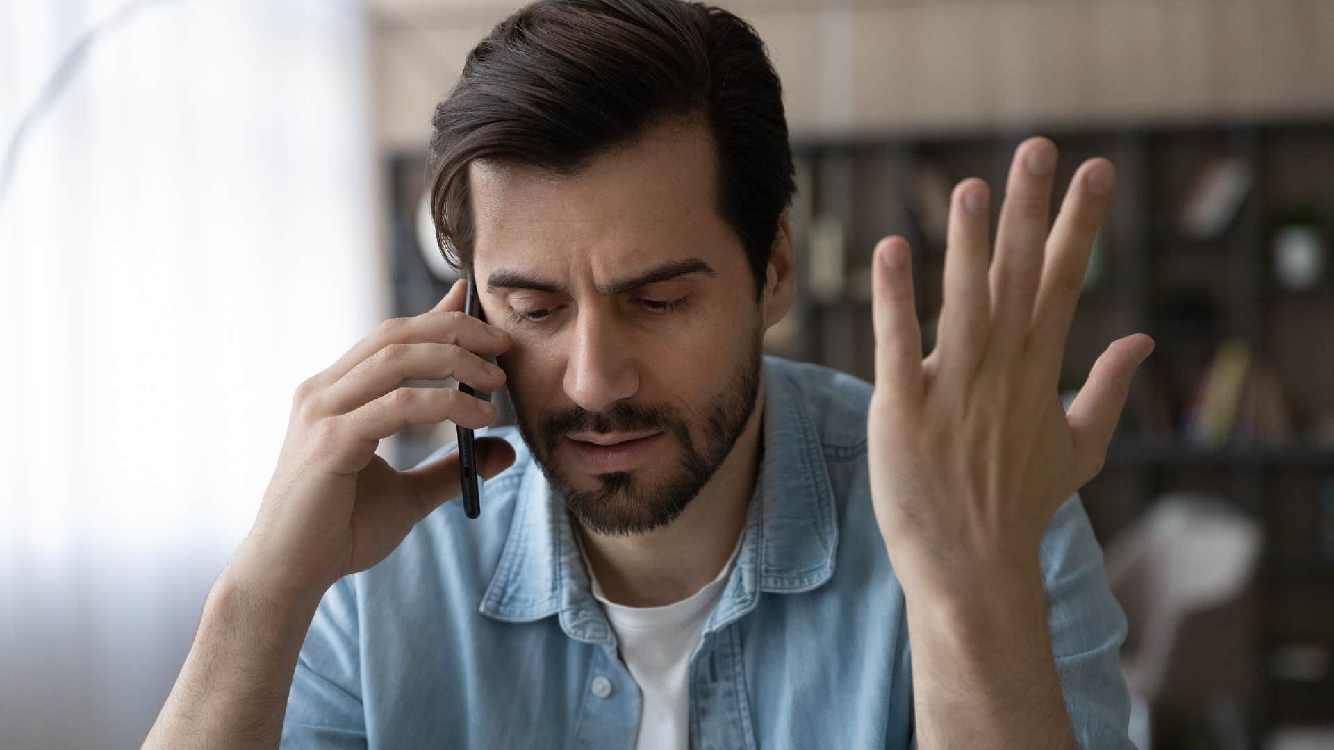 man who is an introvert talking on the phone