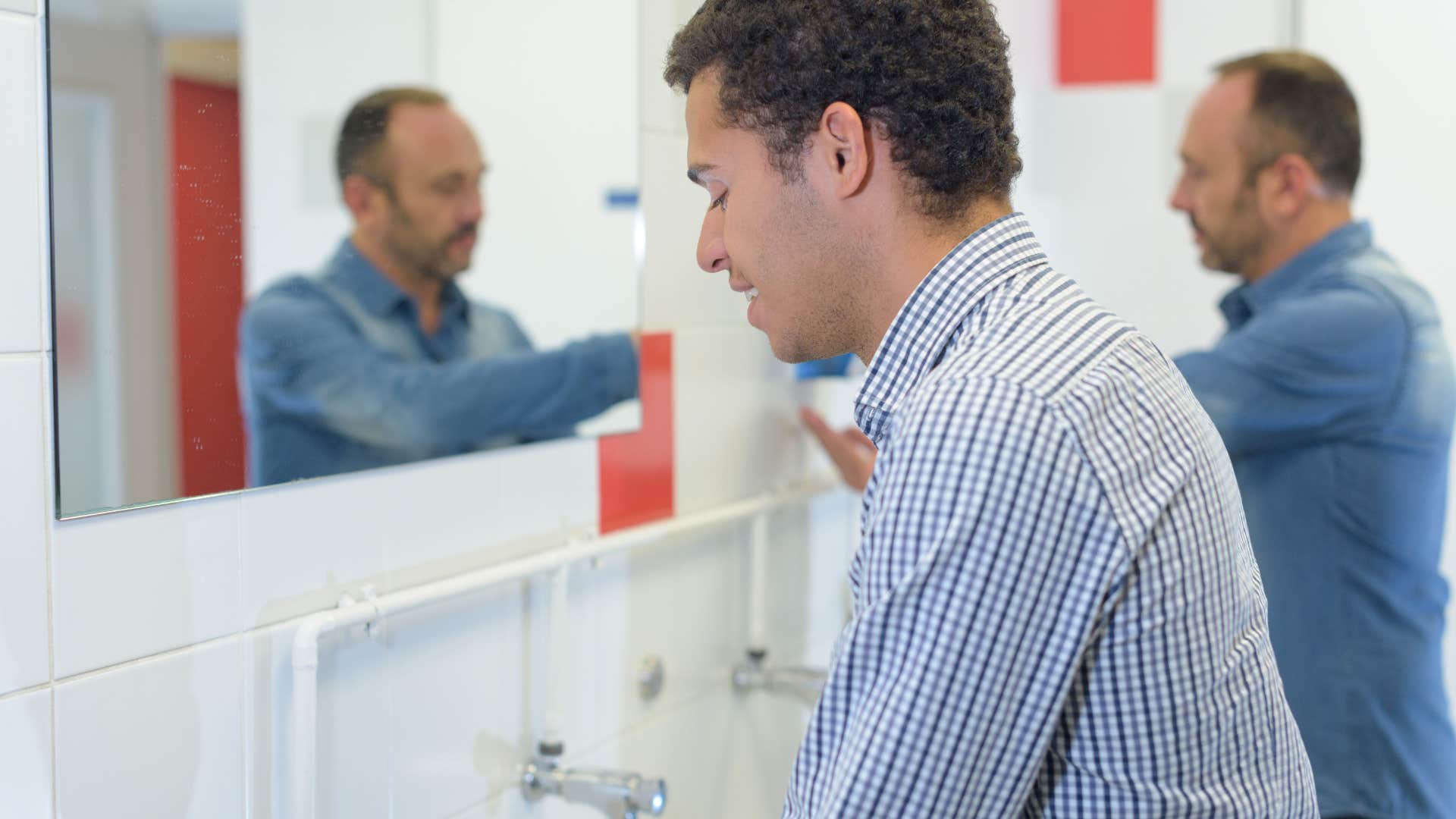 introverted man washing his hands