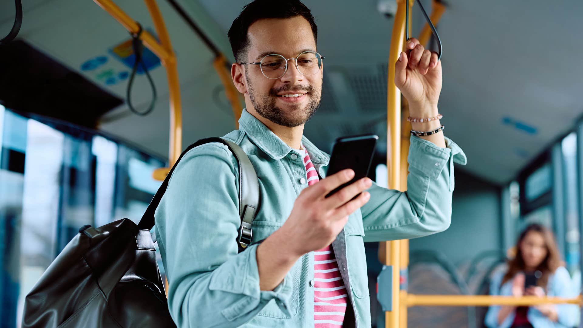 man thinking about people not having a driver's license while riding the bus