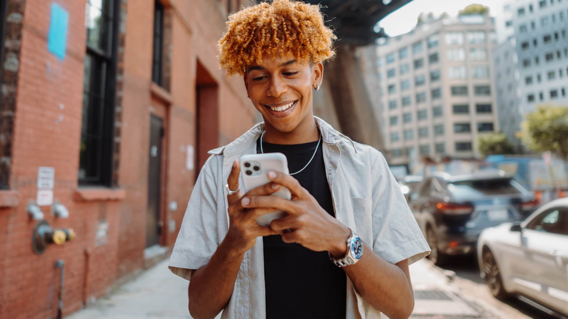 pedestrian smiling and walking around in a big city