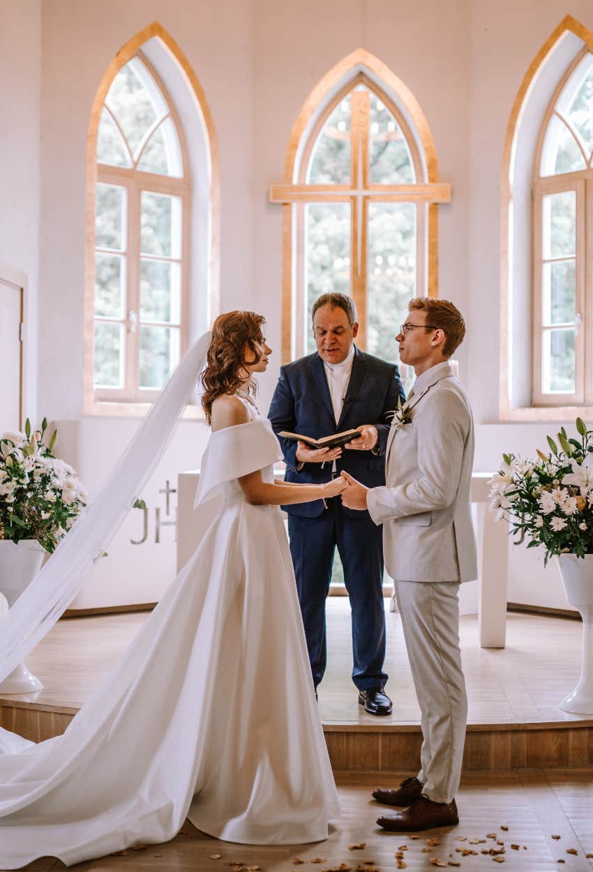 officiant doing the tradition of reading bride and groom's private letters to the entire wedding 