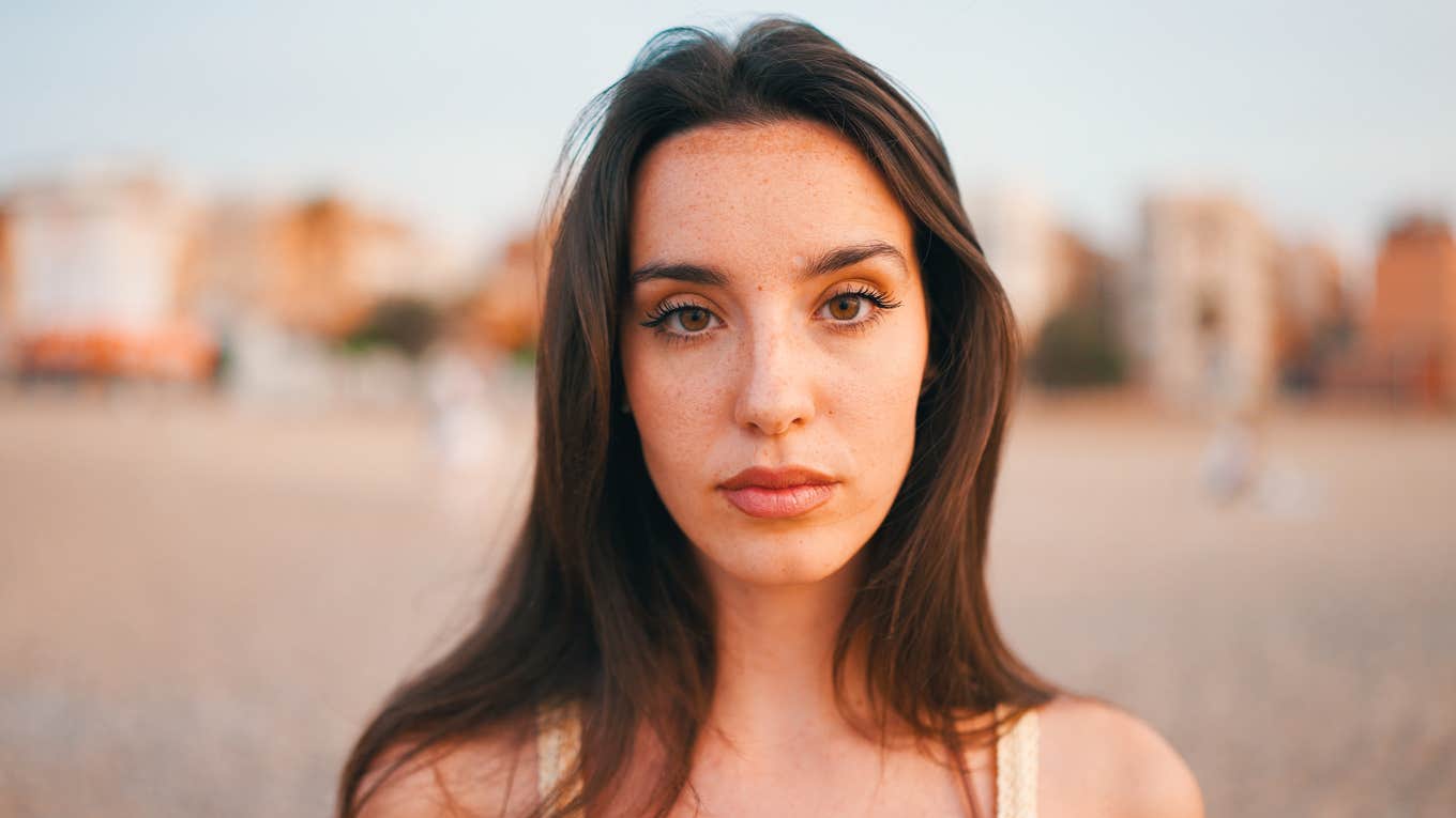 serious woman with long hair thinking about life lessons