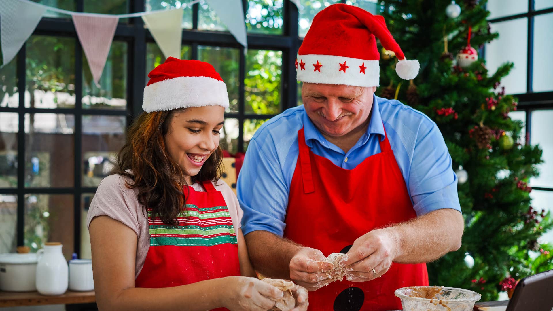 daughter and dad doing a christmas tradition
