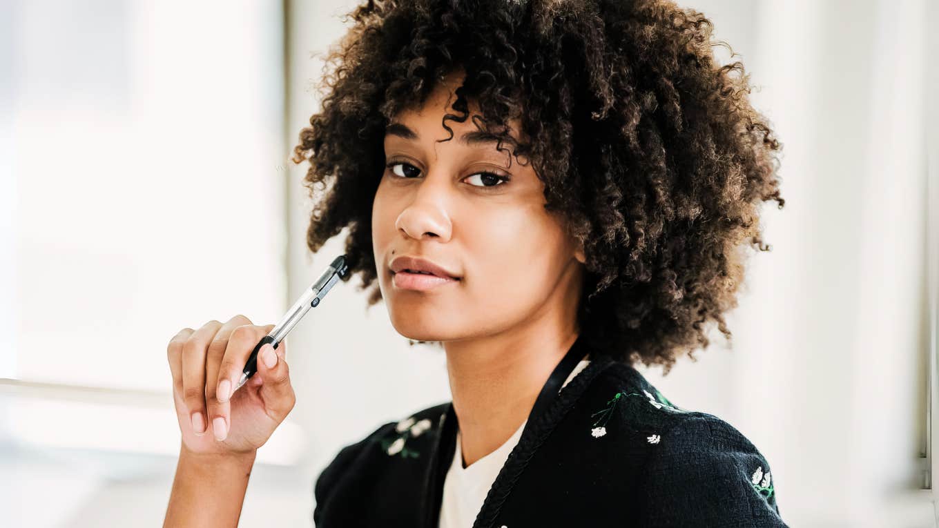People Who End Up In Their Dream Job Have One Quiet Habit In Common Woman at work in her dream job.