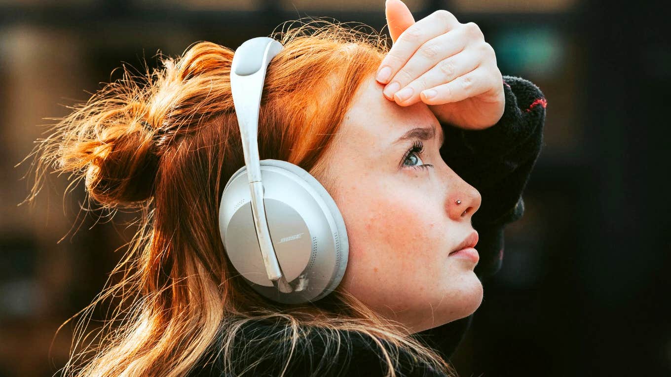 People Who Listen To These Musicians Are Seen As Less Attractive, Says Research Person listening to music.