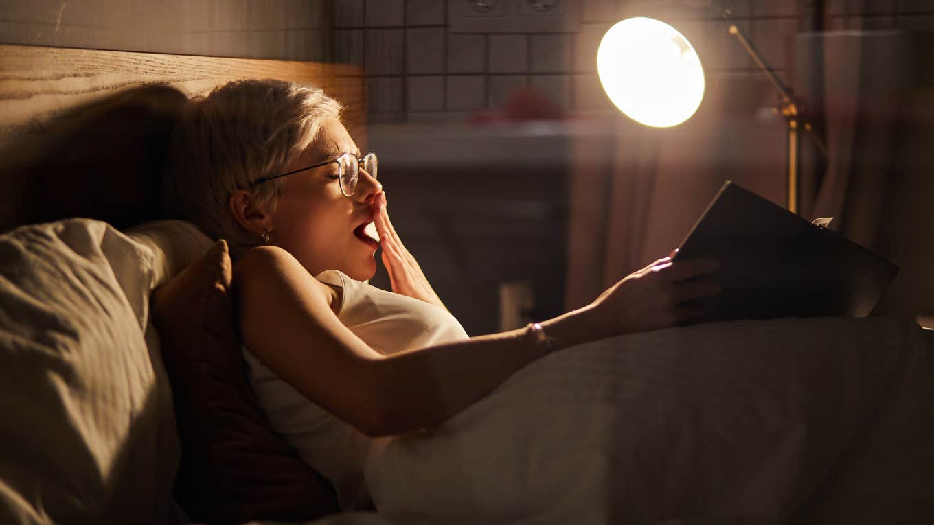 People Who Put Off Sleep Even Though They’re Tired Usually Share These Traits Woman putting off sleep even though she's tired