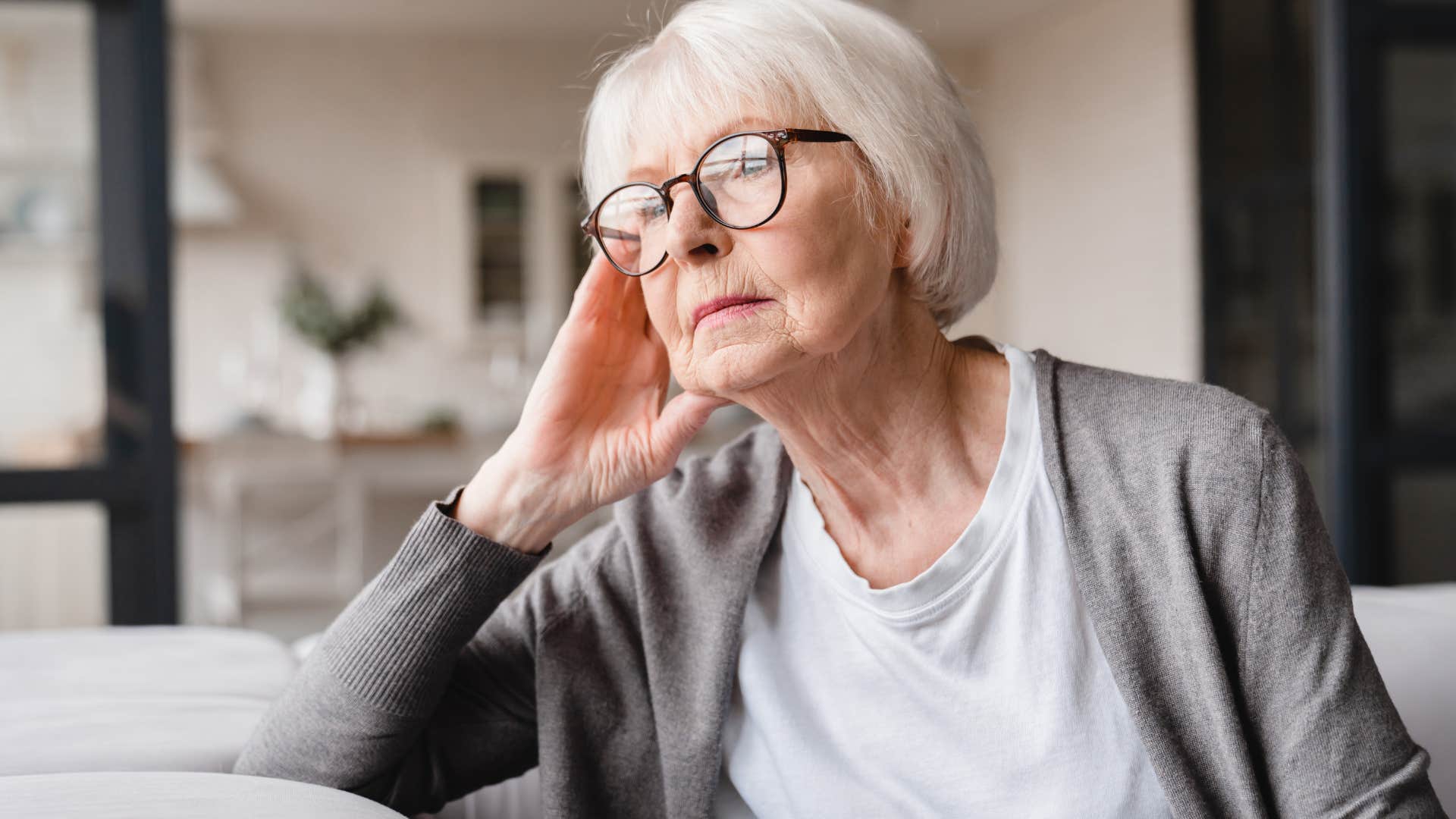 older woman who's drifted away from friends thinking