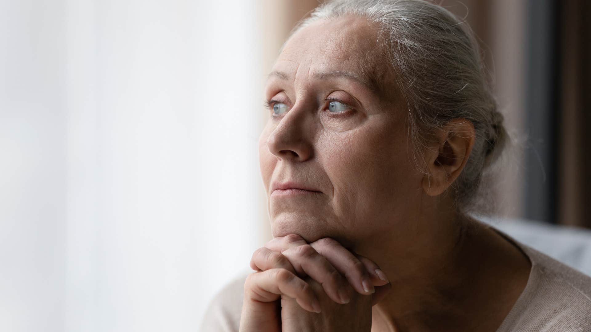 bored older woman looking exhausted staring