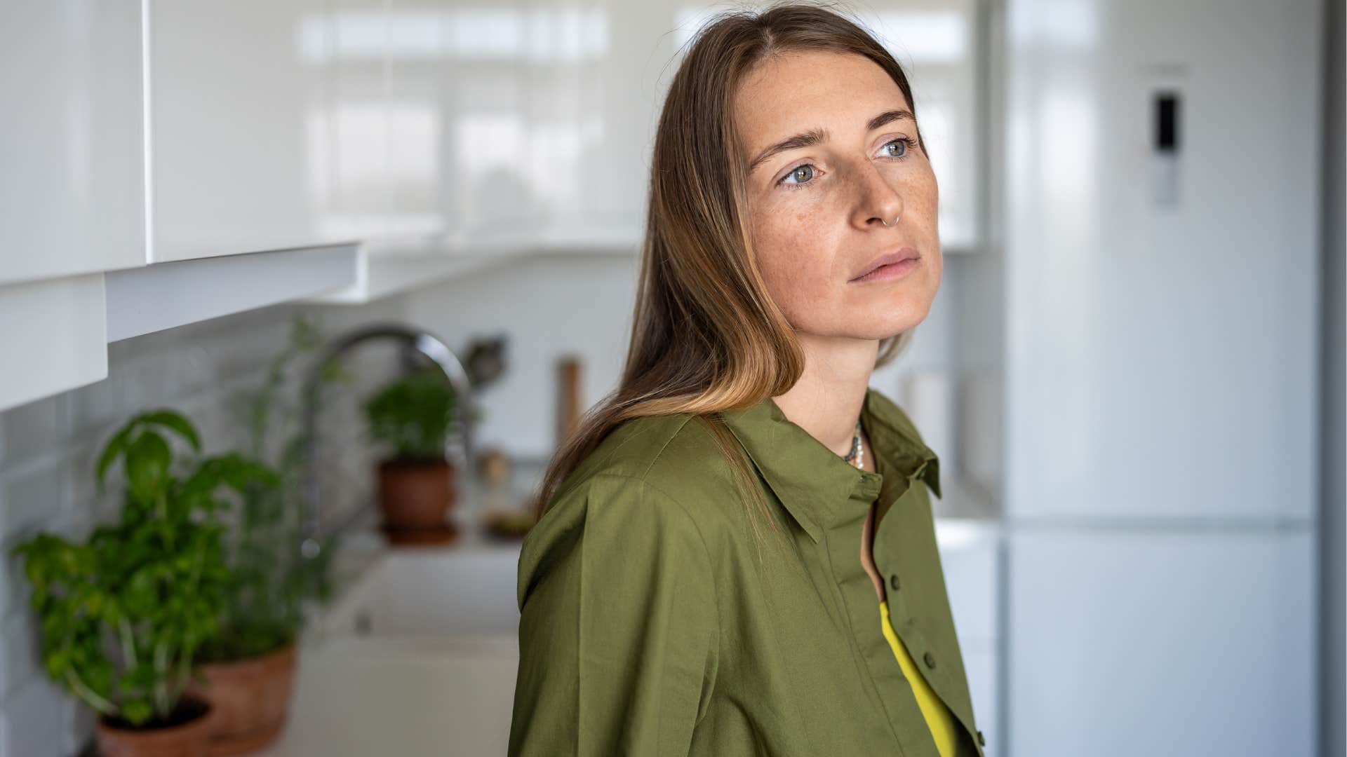 woman who's drifted away from her social circle looking sad