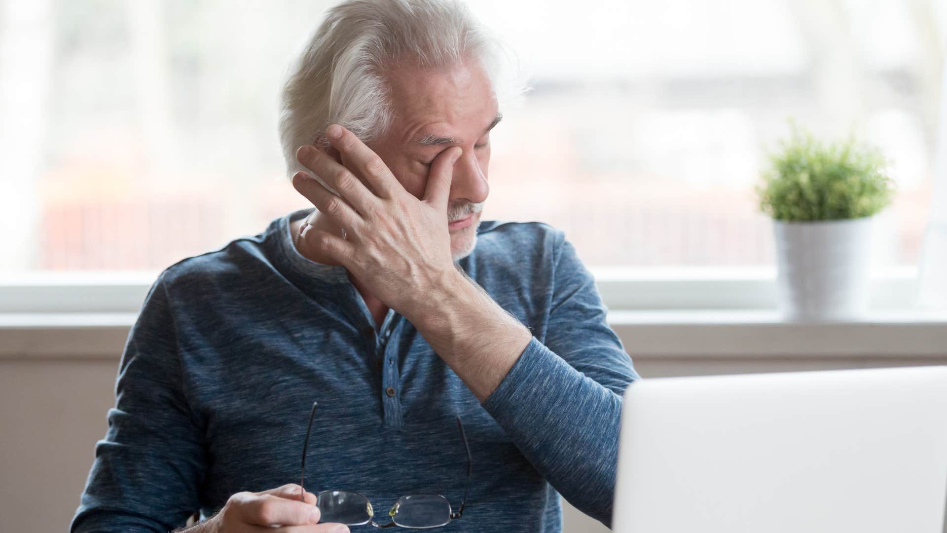 older man who's isolated from family crying