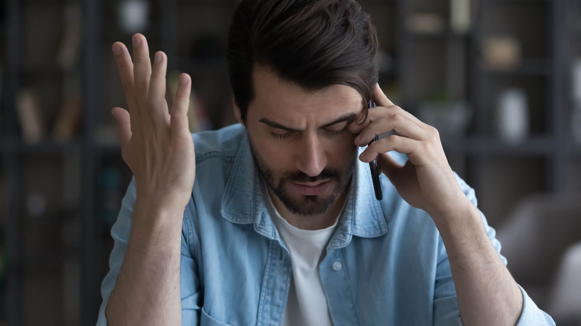 upset man calling his parents saying I've had a lot going on this week