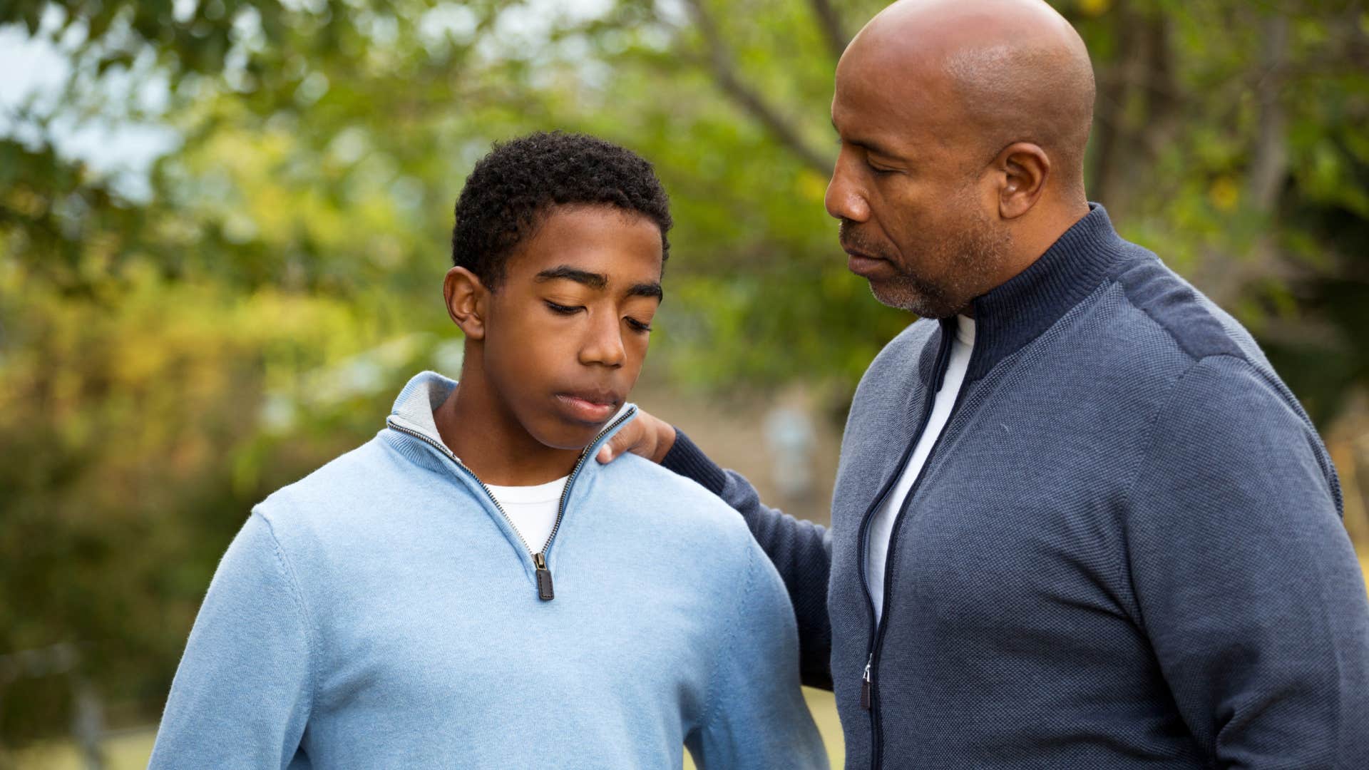 upset young man saying I've been busy to his concerned dad