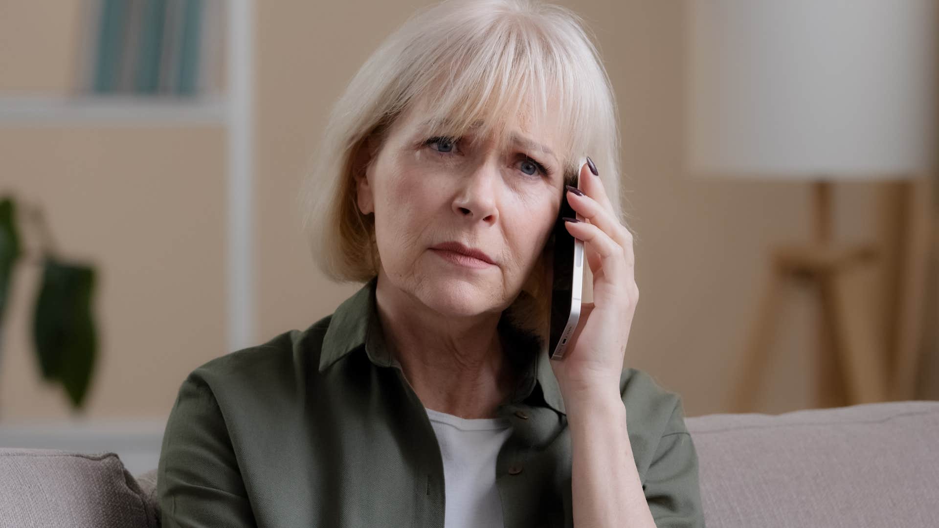 older woman listening to her unhappy child say im used to it