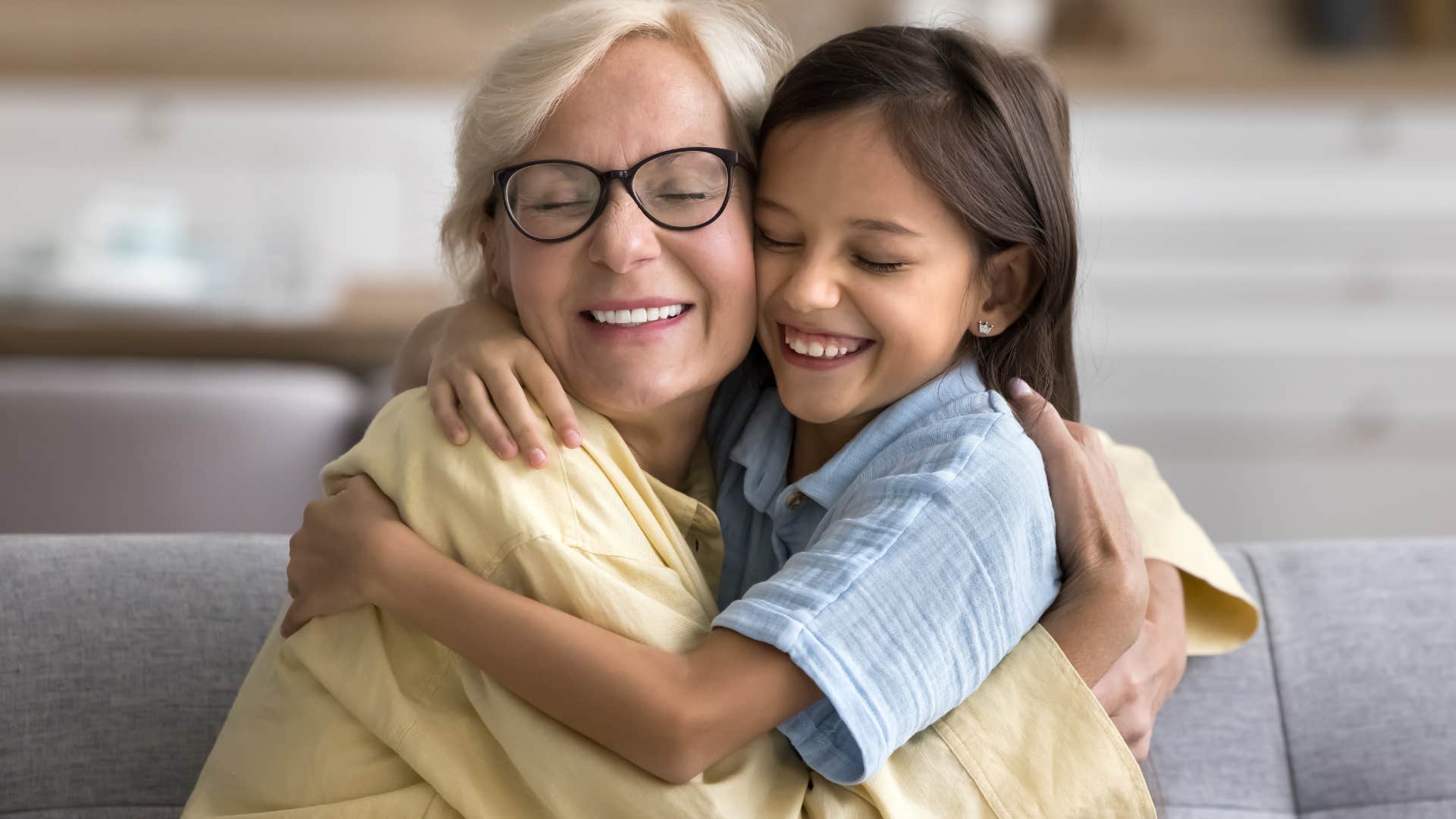 woman saying bless your heart while hugging her granddaughter