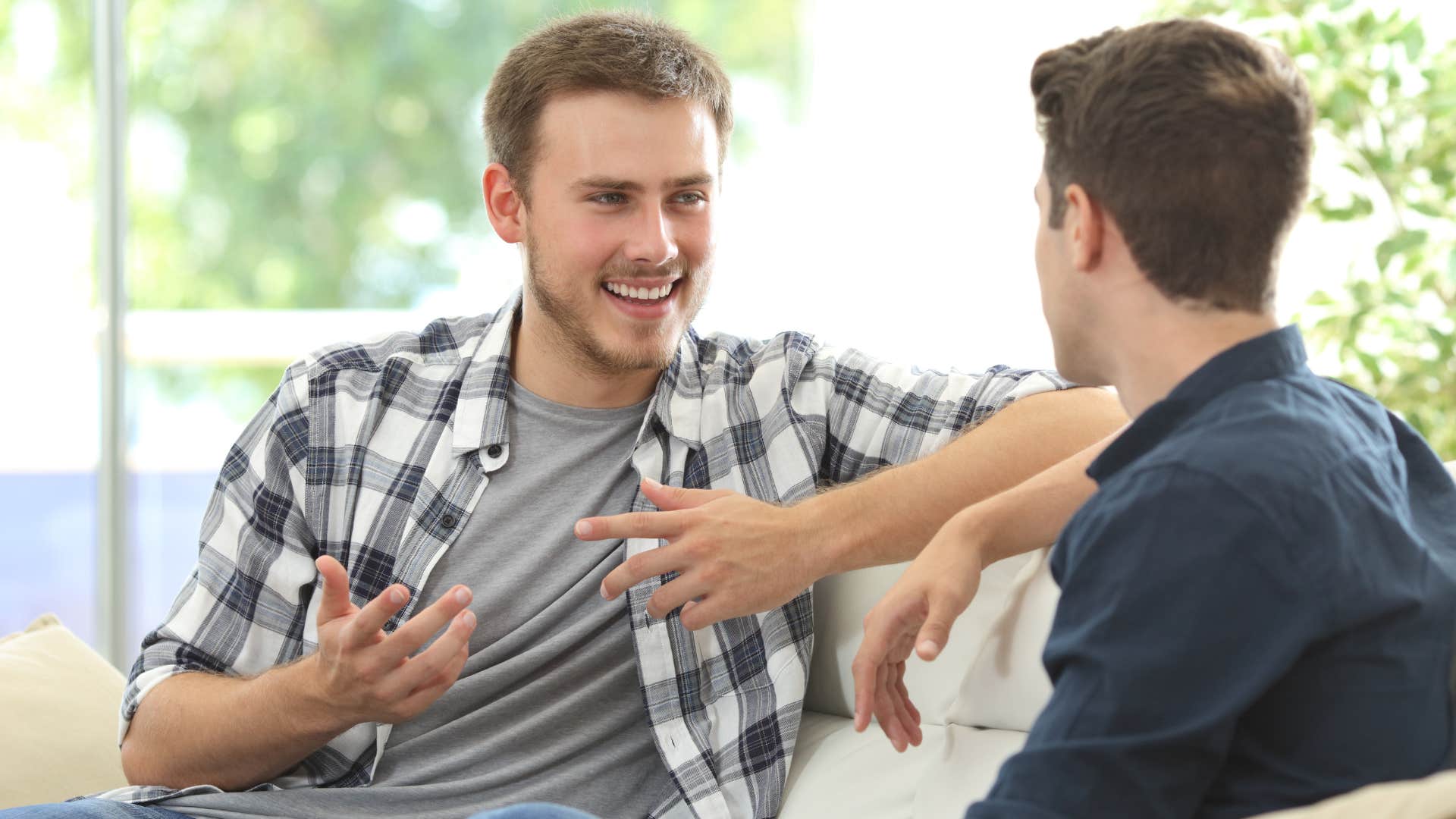 man smiling in conversation with friend saying it's not rocket science