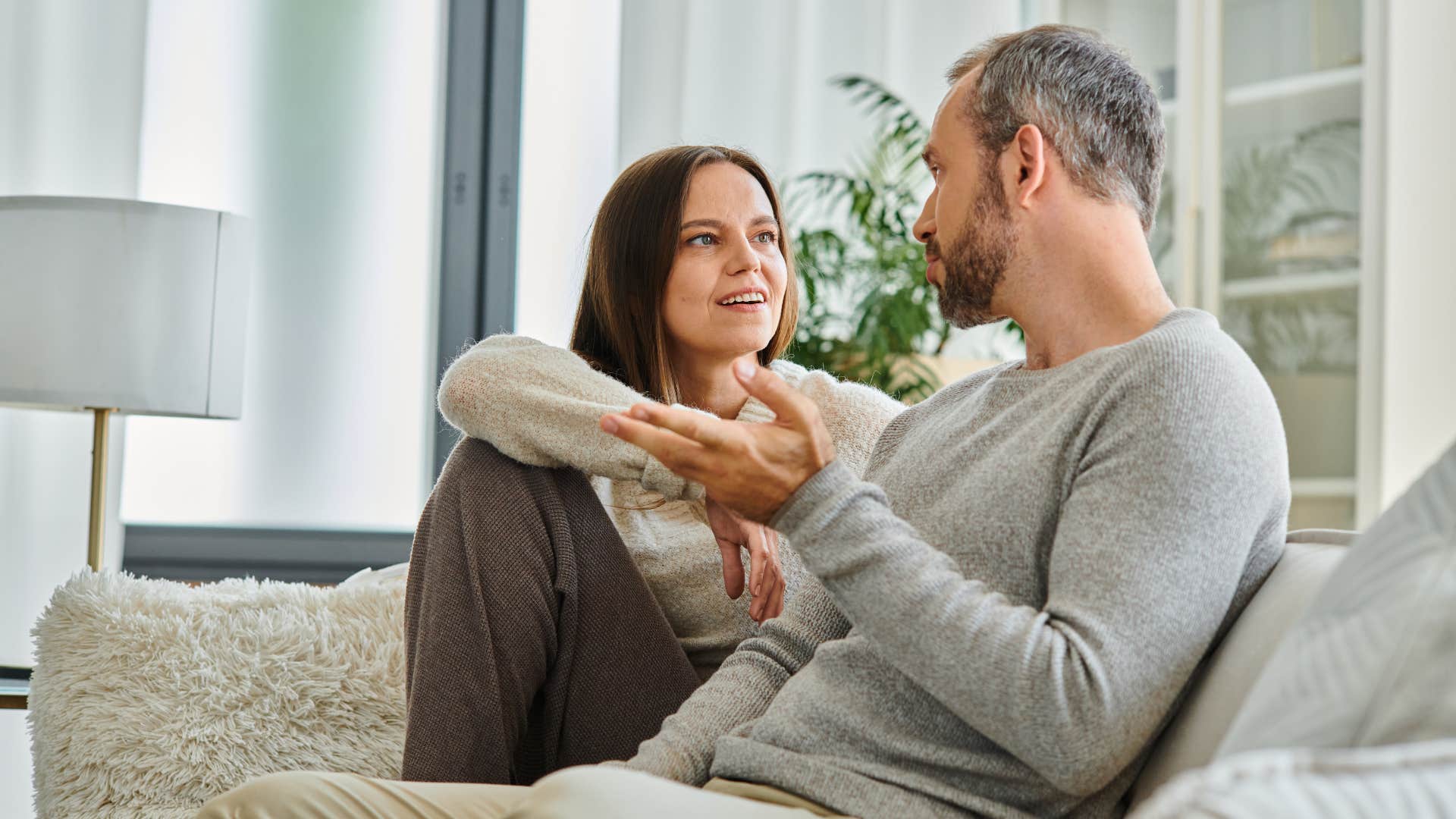 man telling woman he's fixin' to do something