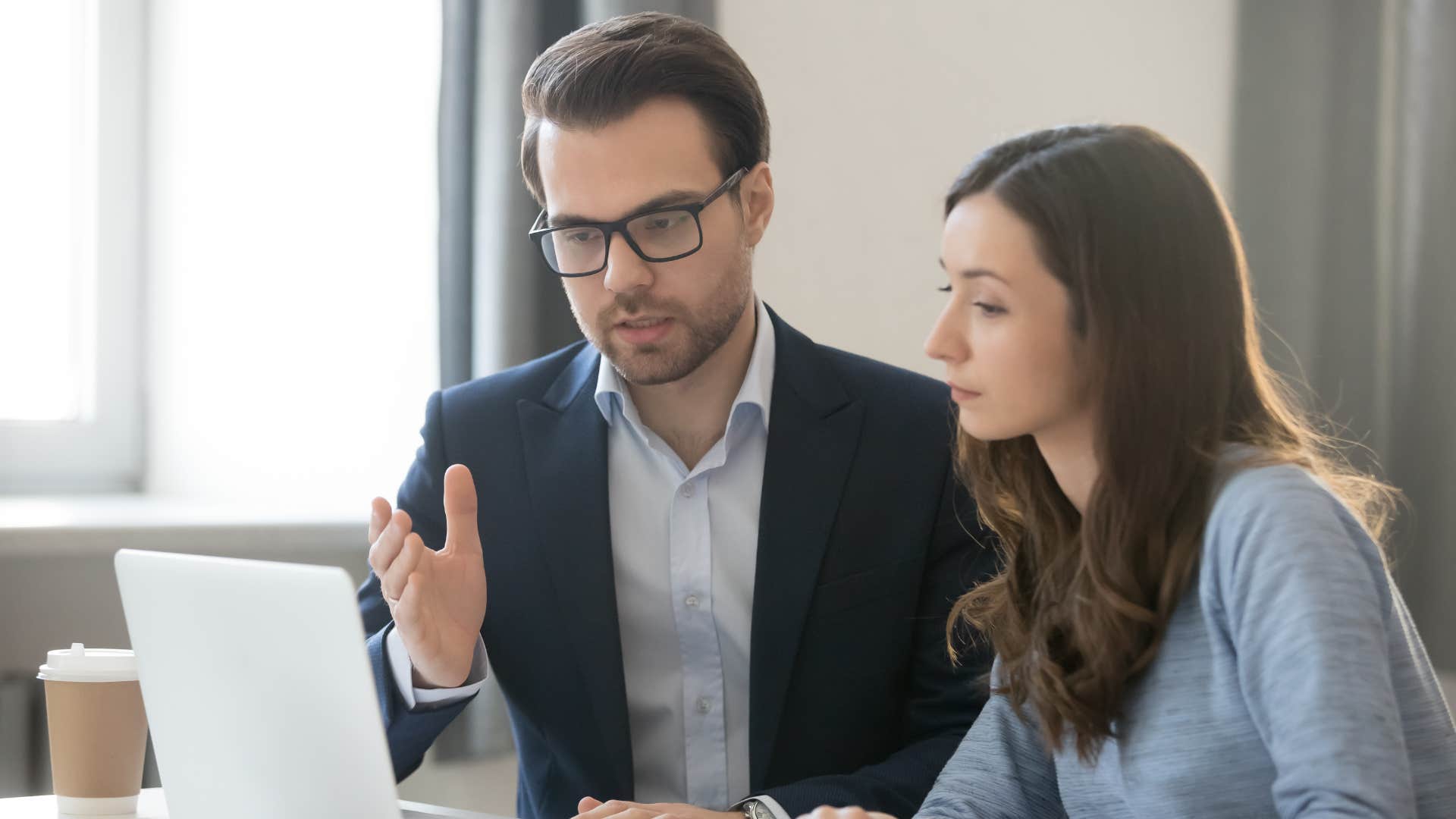 man in suit telling woman that he'd hate to slow things down maybe someone else can be a better fit