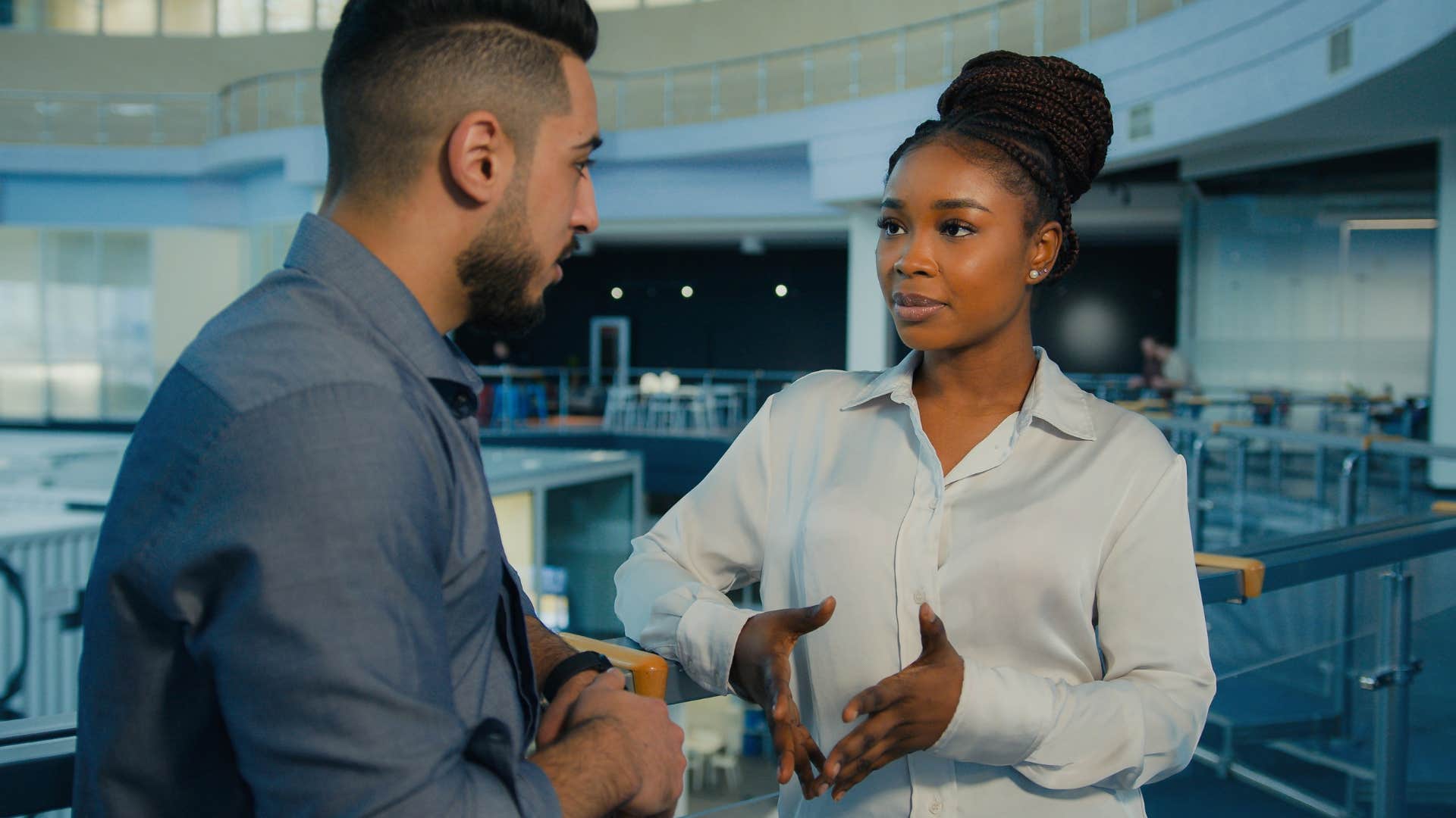 woman in white shirt explaining to man in gray shirt this isn't something i can take on right now but let me know if i can help in another way