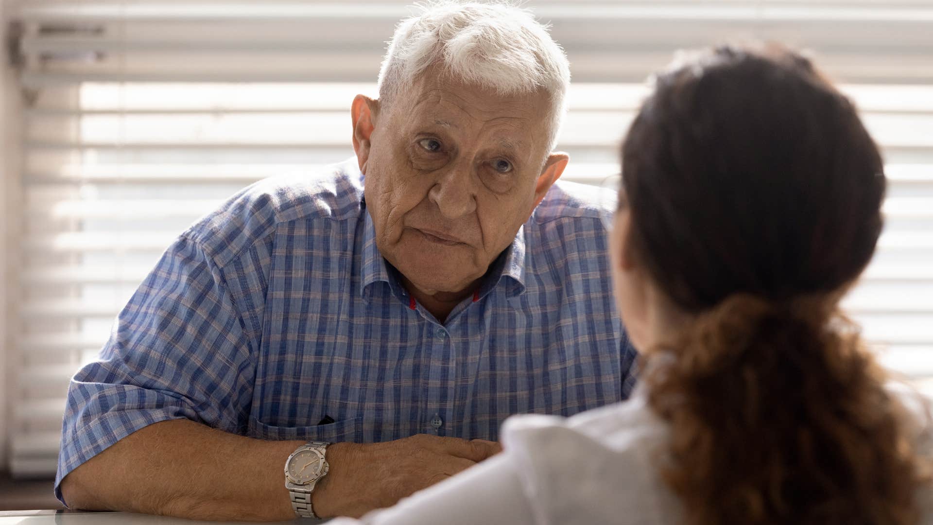Man saying "it's just a joke" to his upset adult daughter.