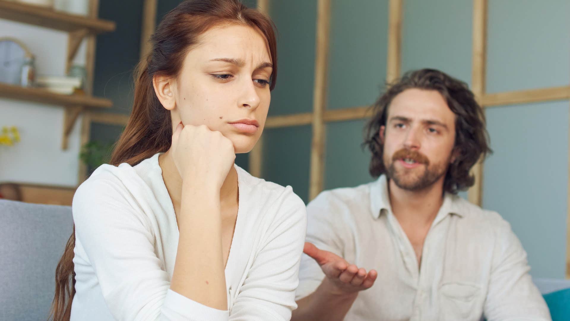 Man saying "I don't see what the big deal is" to his upset wife.