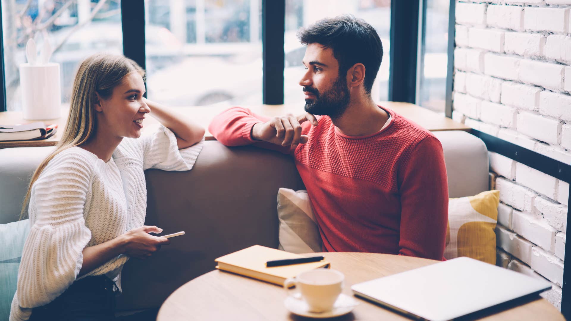 couple on a date with man telling woman shes not like other girls