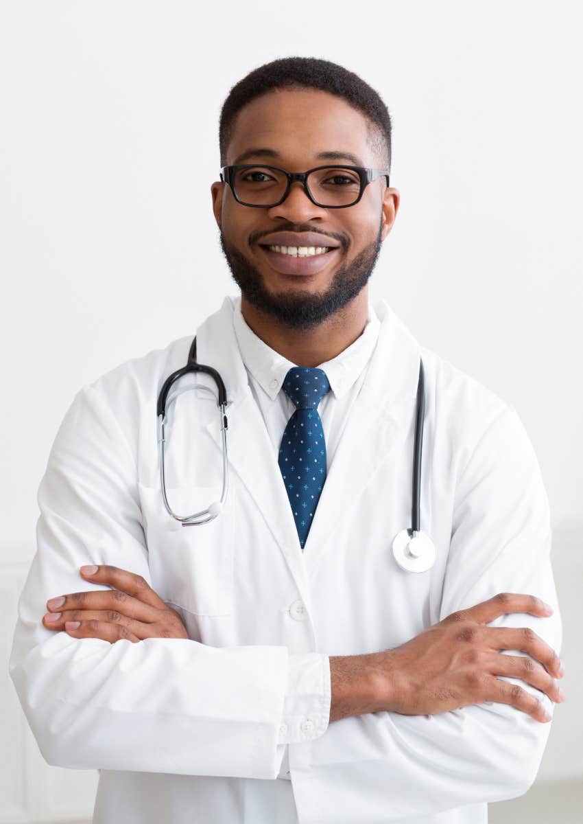 physician smiling because he gets to help people