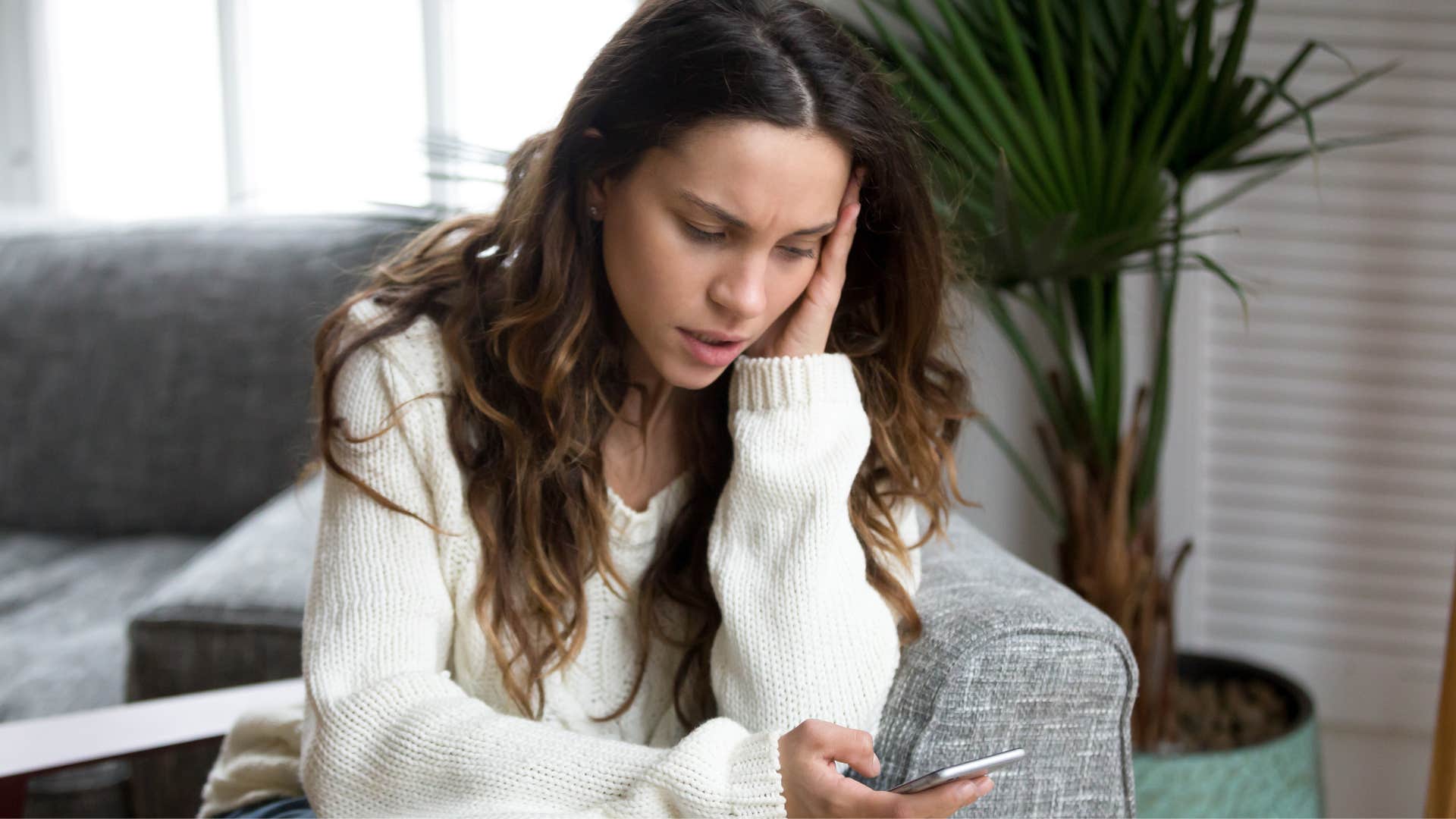 woman who seeks external validation scrolling on her phone