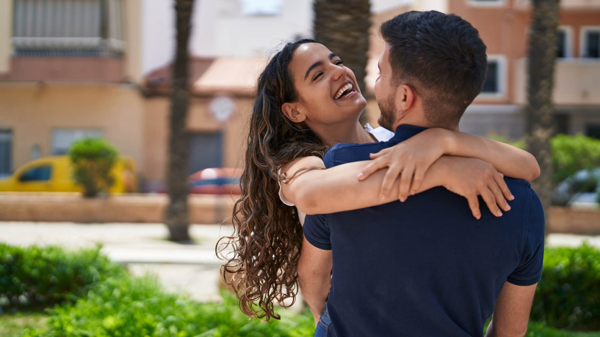 a man shows his woman affection when they are out in public