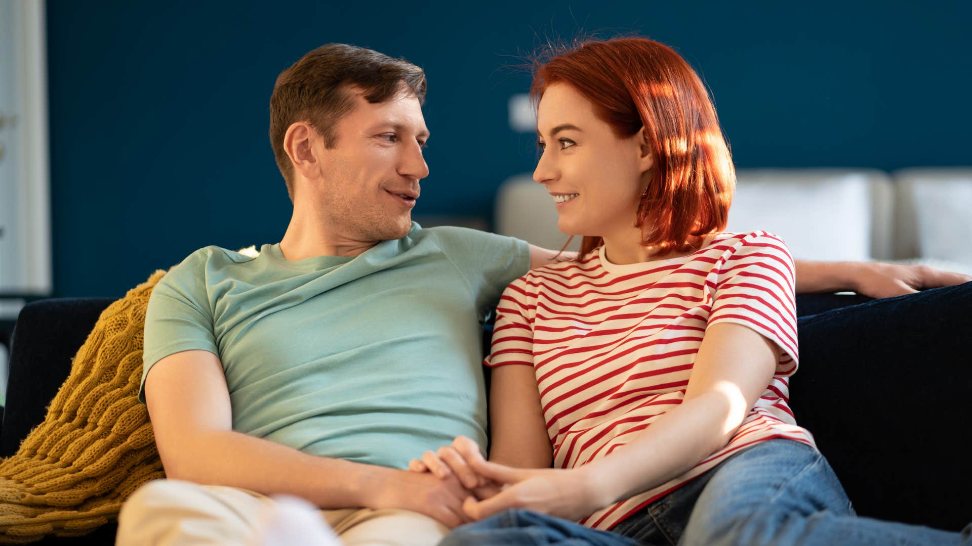 man earning his girlfriends trust holding her hand