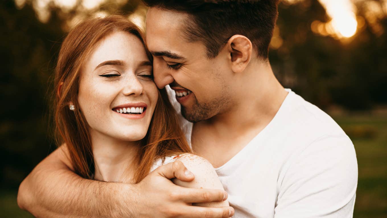Rare Signs A Man Considers You His Everything man hugging woman he loves deeply