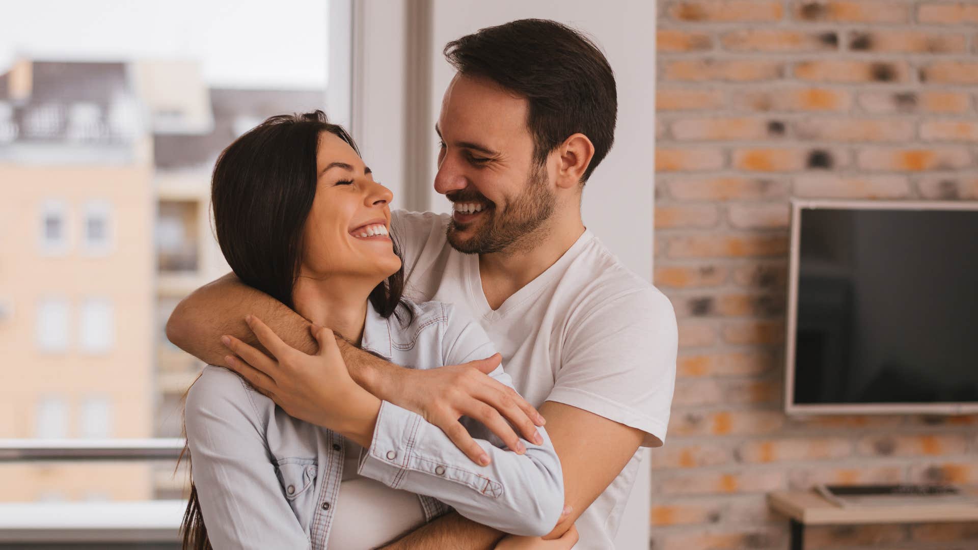 couple looking at each other and hugging as they understand each other without words